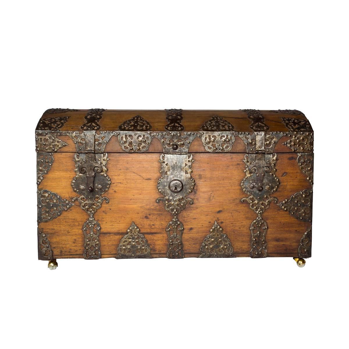 Attributed to the 18th century, this incredibly large and monumental Danish trunk is in incredible condition for its age, comprised of oak and ornamental iron hardware which harks back to the Baroque period. The domed top opens to a smooth, sizable,