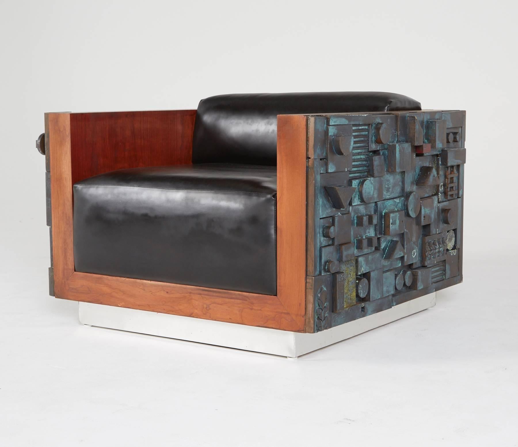 Limited edition, handcrafted lounge chairs by Lou Ramirez. Thick cushions are encased by vibrant wood frames, bookended by abstract Brutalist designs and a stylistic, manufactured patina. Elevated by a base with light metal laminate.

The