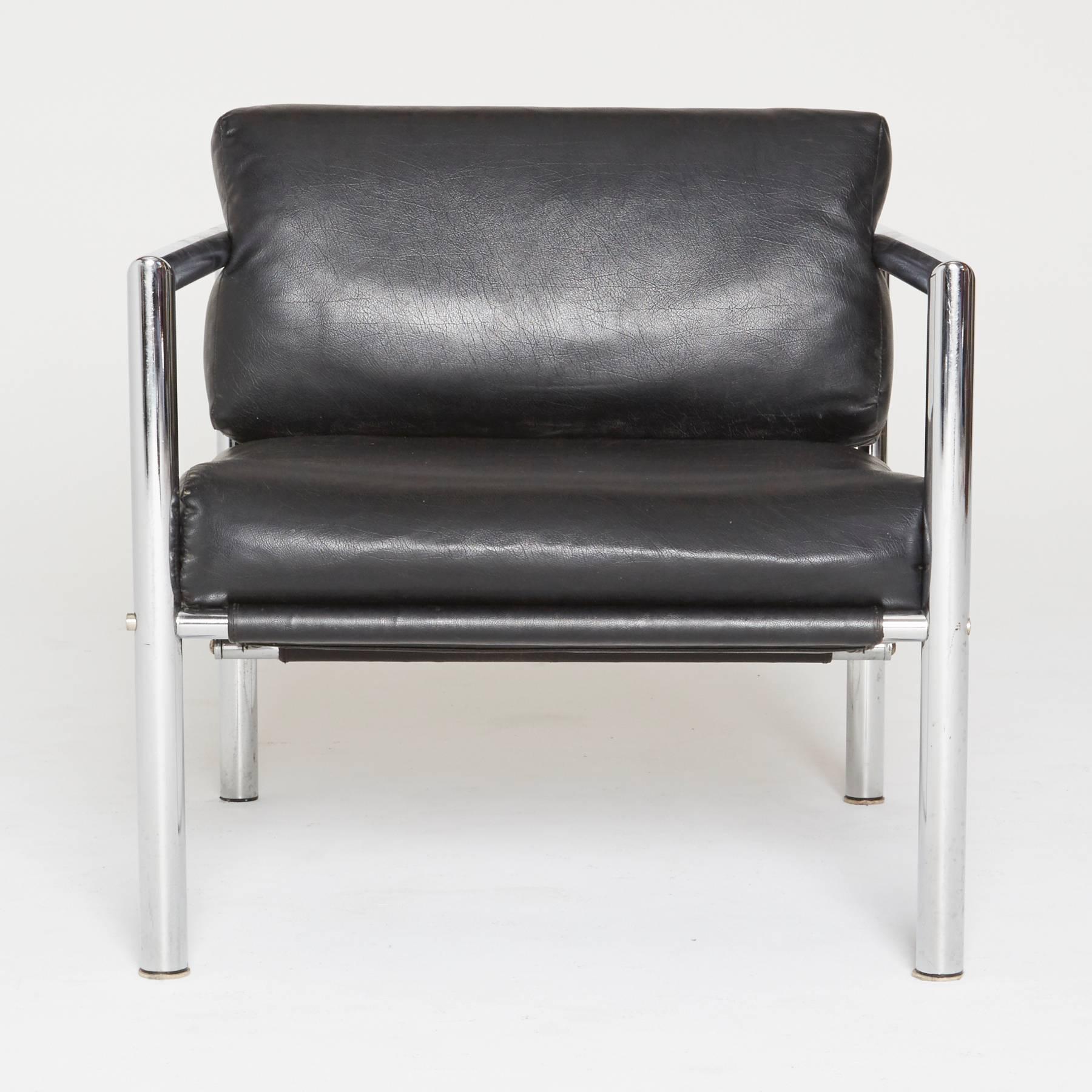Sleek, attractive and cool. Tubular chrome frames create the squared armrests, with black cushions resting in the sling supports similar to styles of Martin Visser and Roger Sprunger for Dunbar. The perfect lounge for a stylish living room, dapper
