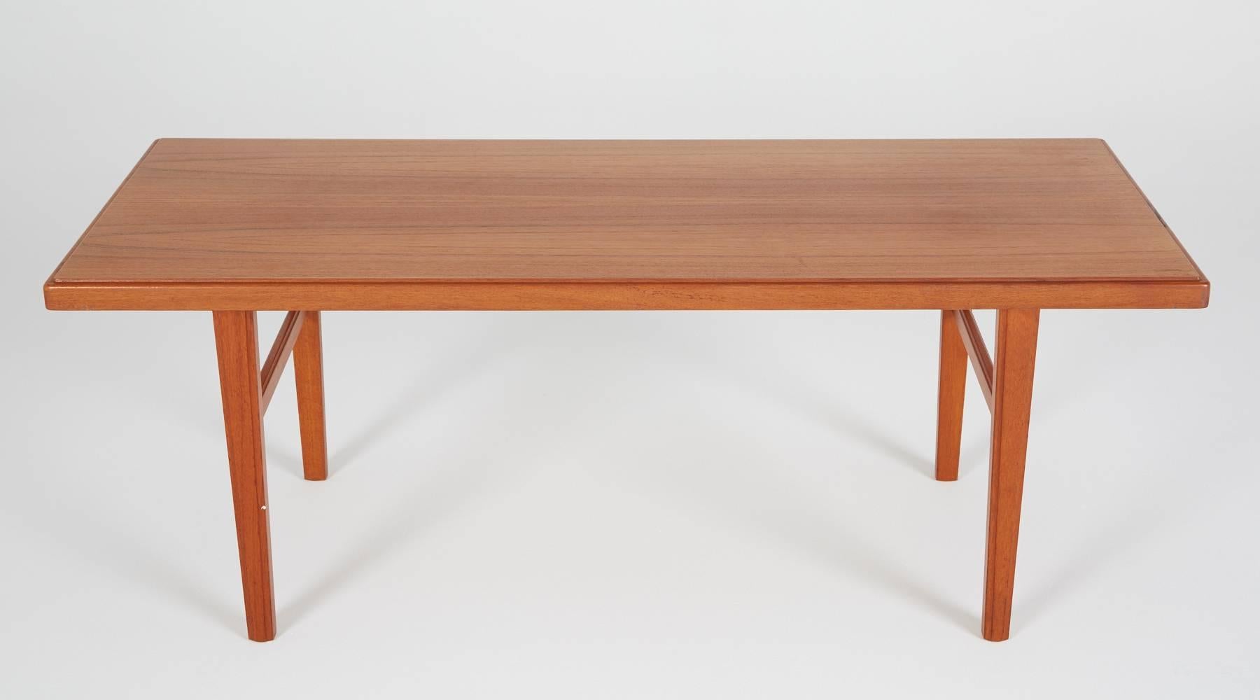 Clean lines, tapered legs, and rich teakwood construction, this is a great example of a Classic, Mid-Century Modern Danish furniture. This long table of 58