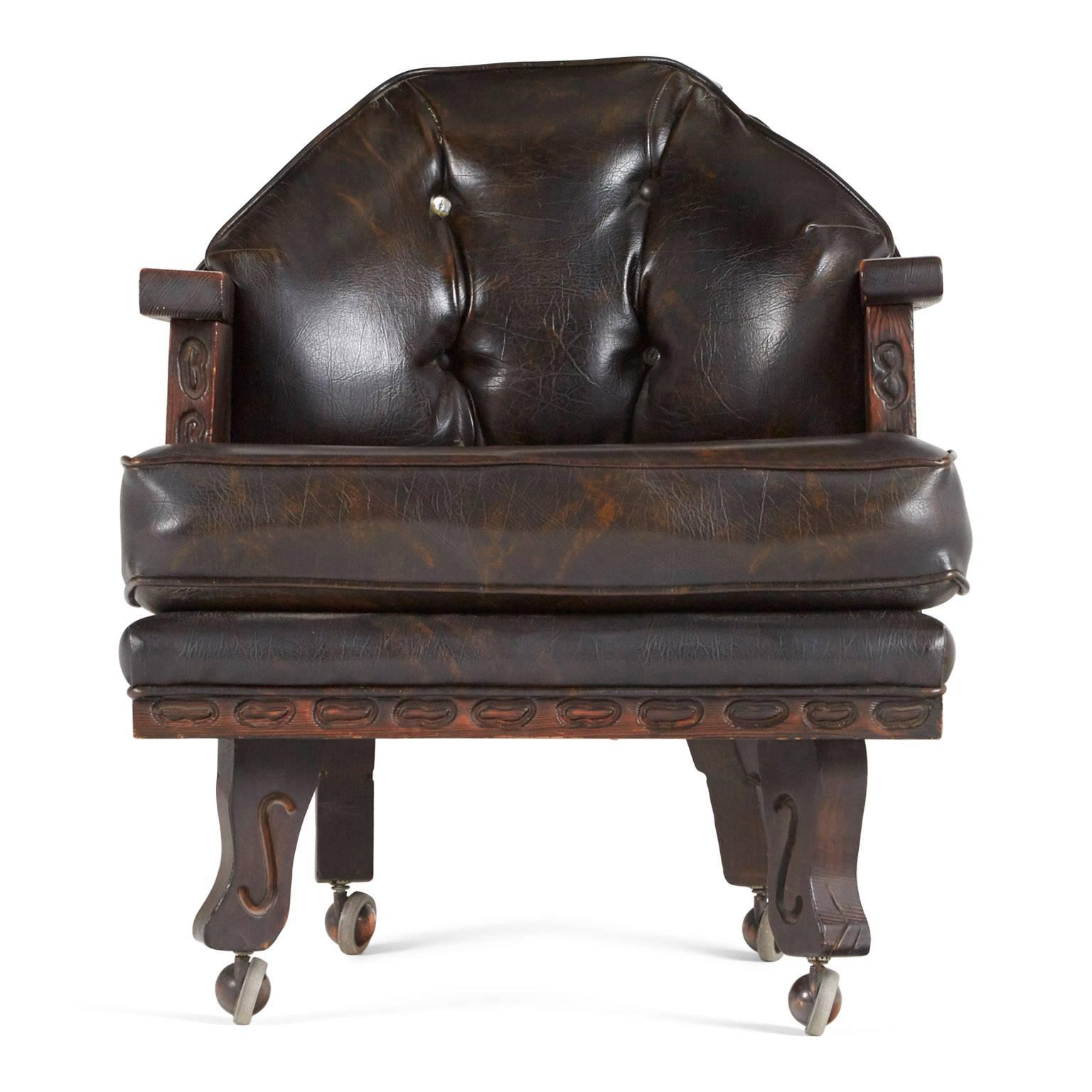 This ornately crafted red walnut club chair with carved exotic details is a testament to William Westenhaver's Modern Primitive creations. Influenced by Polynesian natives sculpting their ancestral deities in to wood furnishings, Westenhaver fused