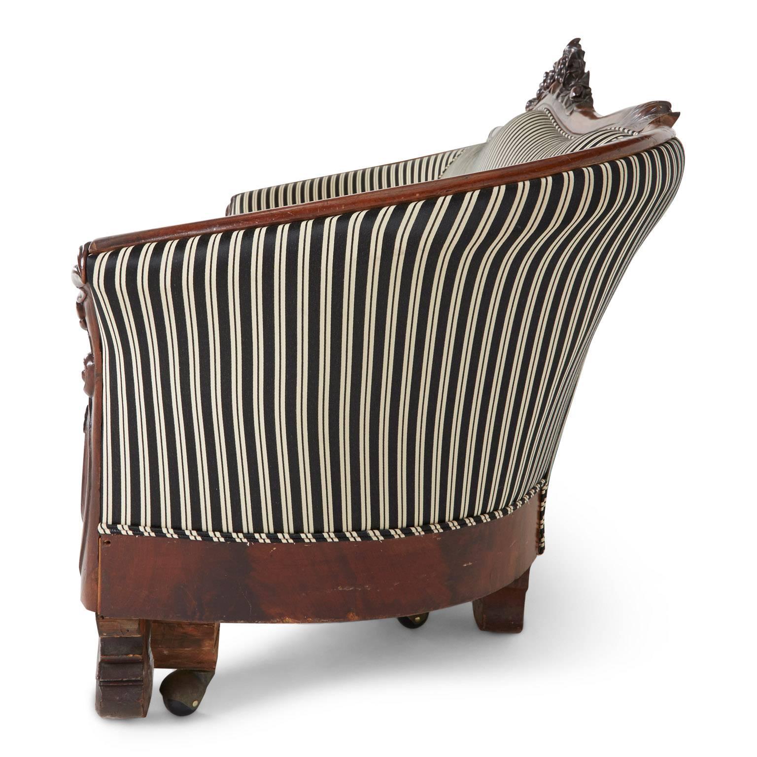 Late Victorian Victorian Rococo Revival Sofa, Carved Walnut with Striped Upholstery, circa 1880