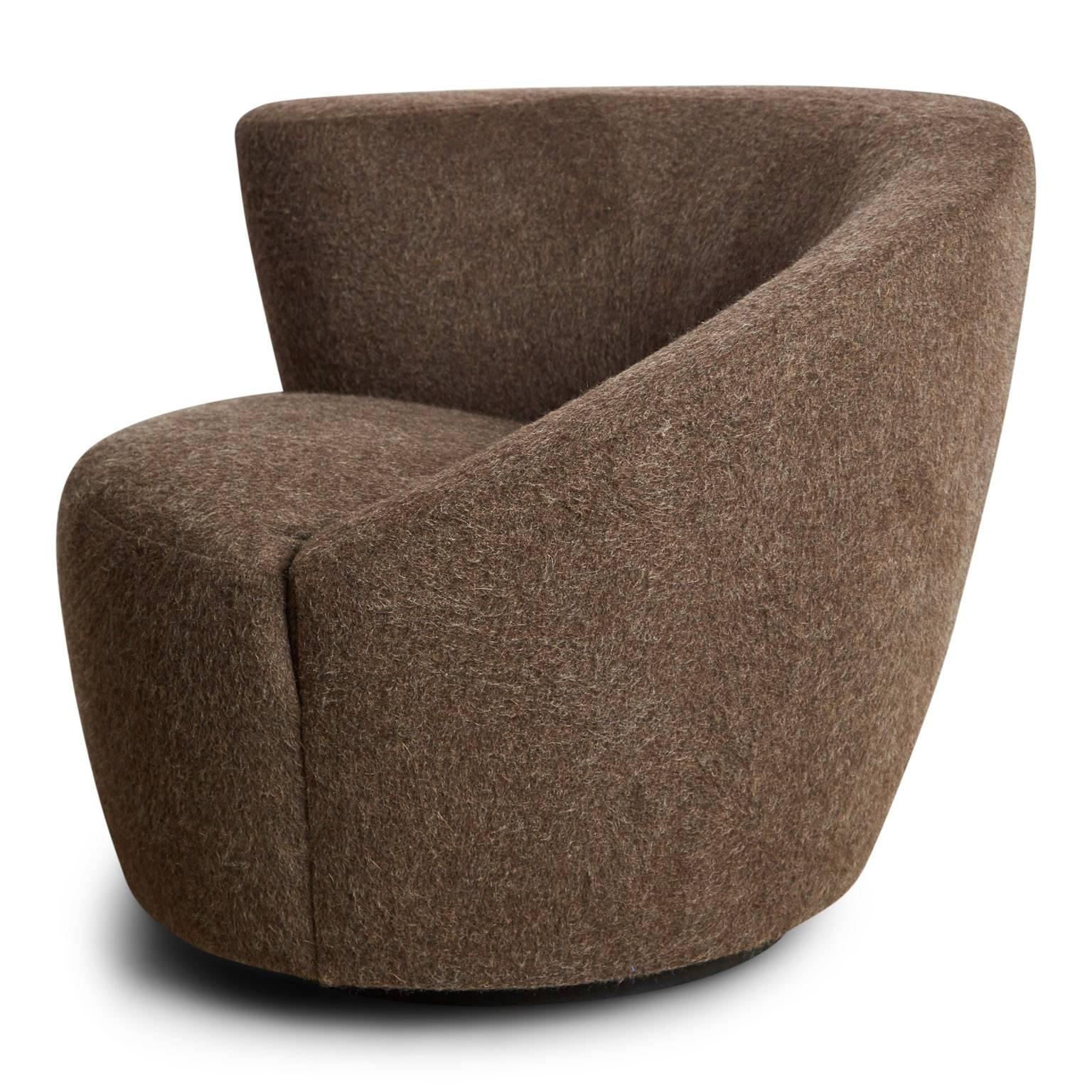 Newly restored Nautilus swivel chair by Vladimir Kagan for Directional, circa 1970. Kagan's use of sculpture and asymmetry in this piece was inspired by the marine species, Nautilus. Newly upholstered using a plush charcoal brown wool, this club