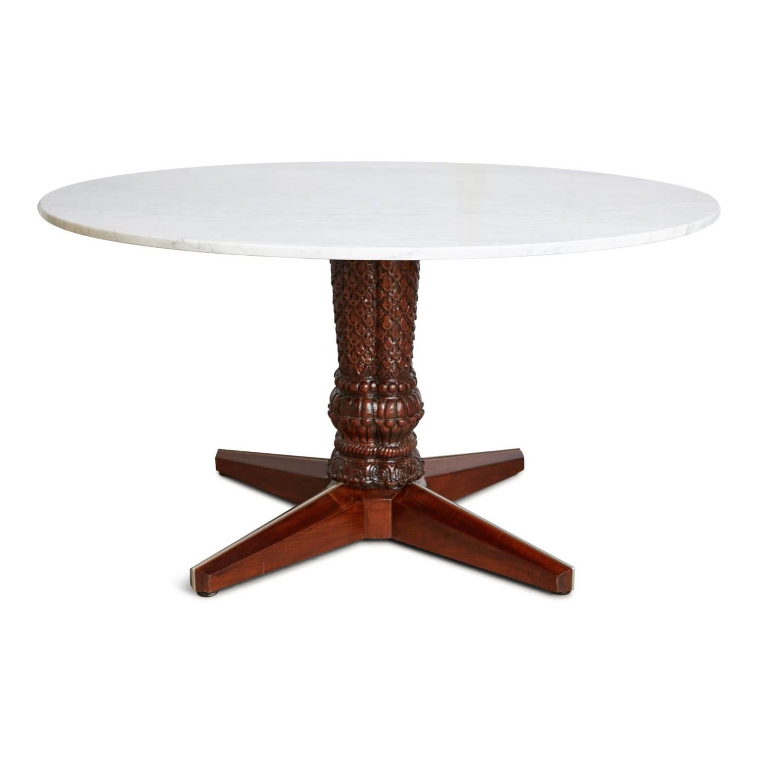 This game table by Maurice Bailey for Monteverdi-Young features an exquisite hand-carved solid walnut base, which has been newly refinished in a high gloss lacquer and topped with a beautiful carrara marble surface. Monteverdi-Young was renowned for