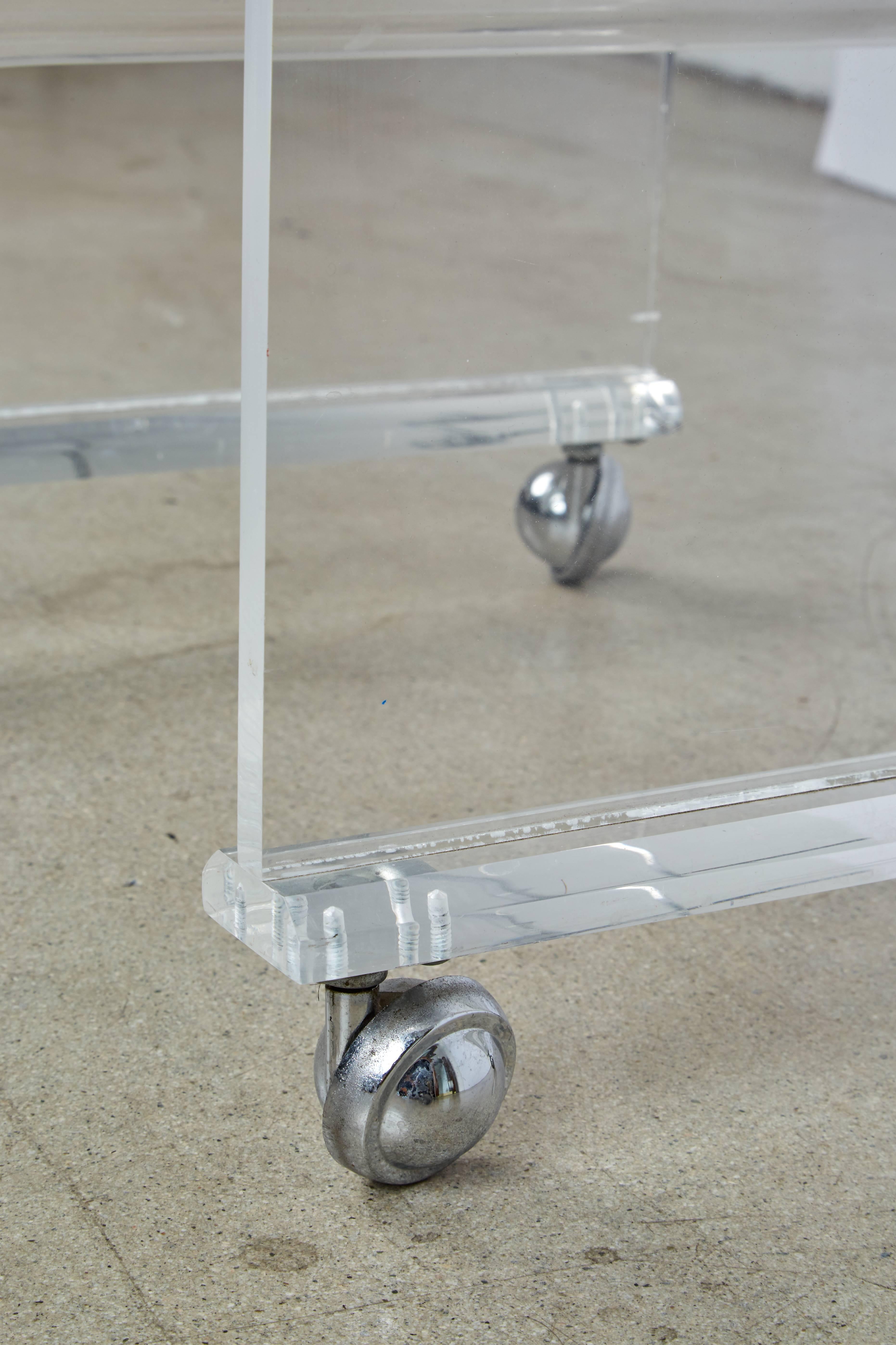 Molded Bent Lucite Magazine Rack or Side Table on Casters, circa 1960