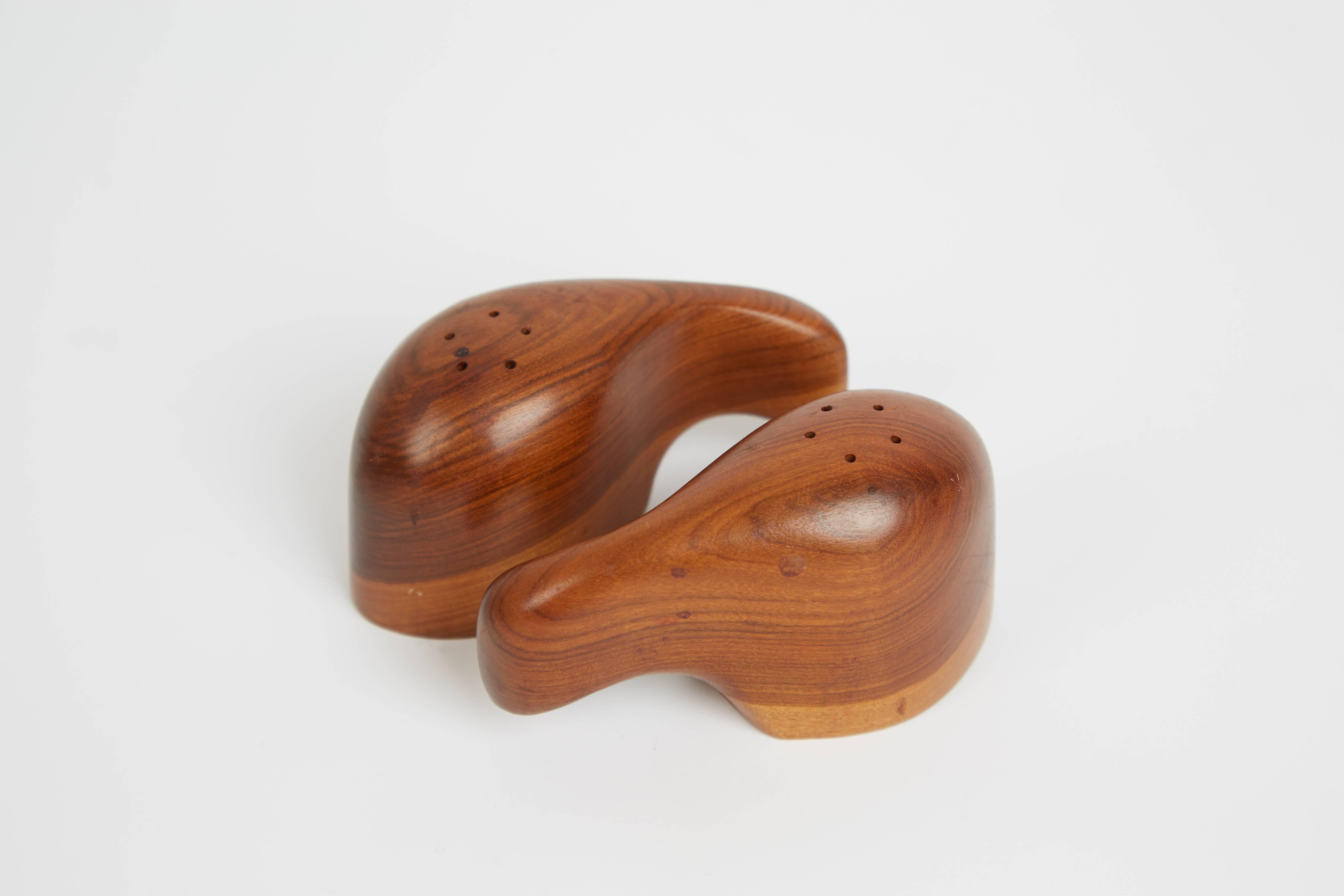 Exquisitely crafted interlocking salt and pepper sets designed by Don Shoemaker for Sen~al of Mexico. Taking advantage of the expertise provided by Mexican artisans, Shoemaker founded Sen~al which produced utilitarian objects, such as these stunning