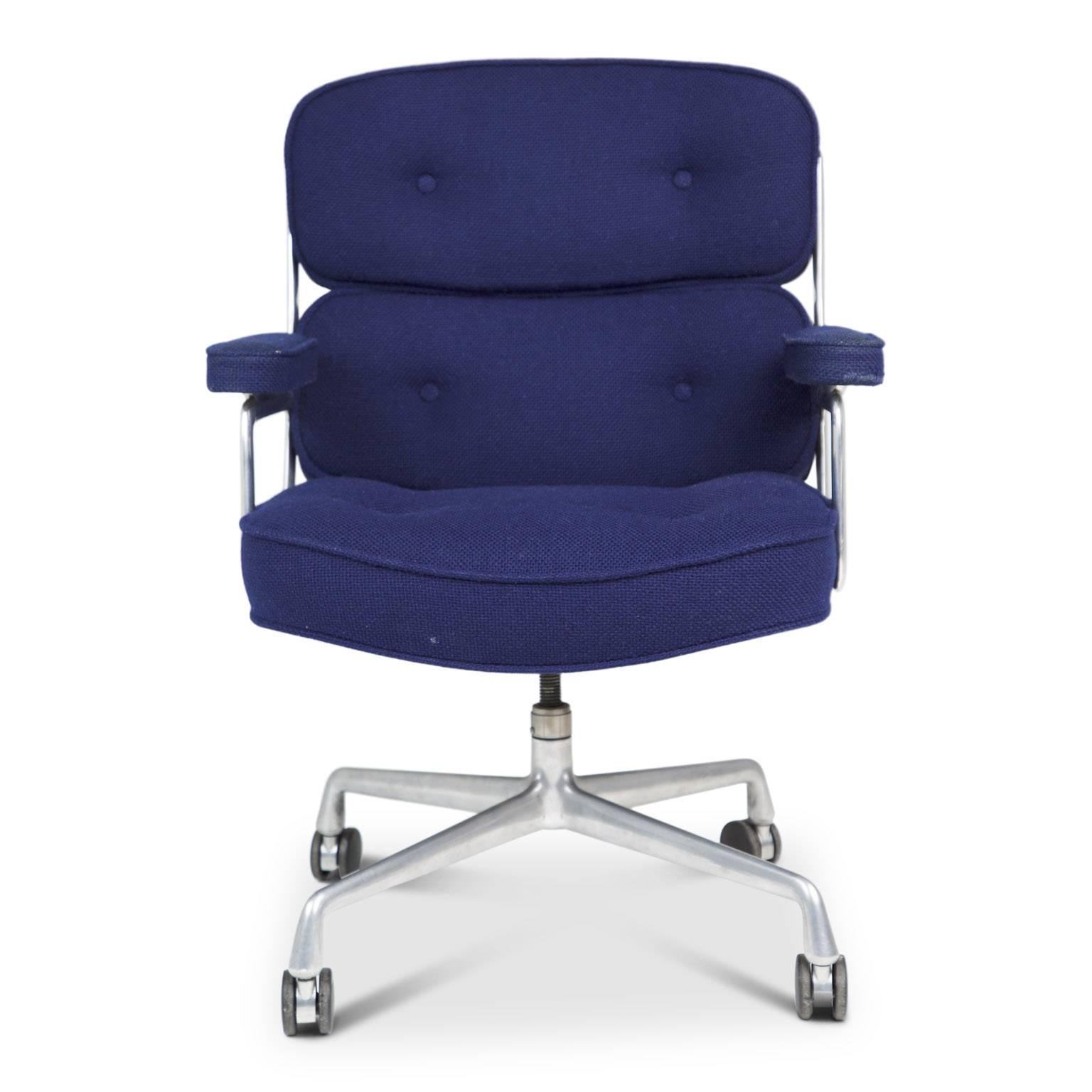 Designed by Charles Eames in 1959 for the Time Life building in New York City, this executive office chair still claims its tenure as the pinnacle of professional style. 

Upholstered in an on-trend deep royal blue woven wool material with tufting