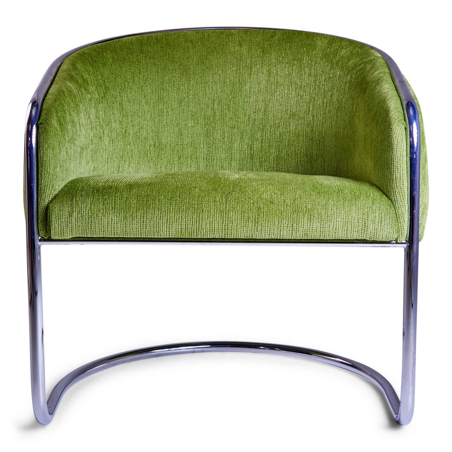 Sculptural armchair by Anton Lorenz for Thonet that possess graceful usage of arches and contours. Featuring a sleek chrome cantilever base which extends to encase the arms and the back and vibrant green plush chenille upholstery. 

This club
