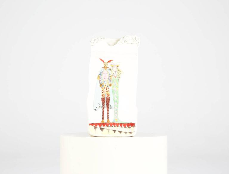 Add a whimsical touch to your home with ceramic artwork sculpture by Elizabeth Allen, signed and dated 1982. 

This surrealist interpretation of the famed Lewis Carroll characters are painted in a quirky, unconventional style draped in colorful