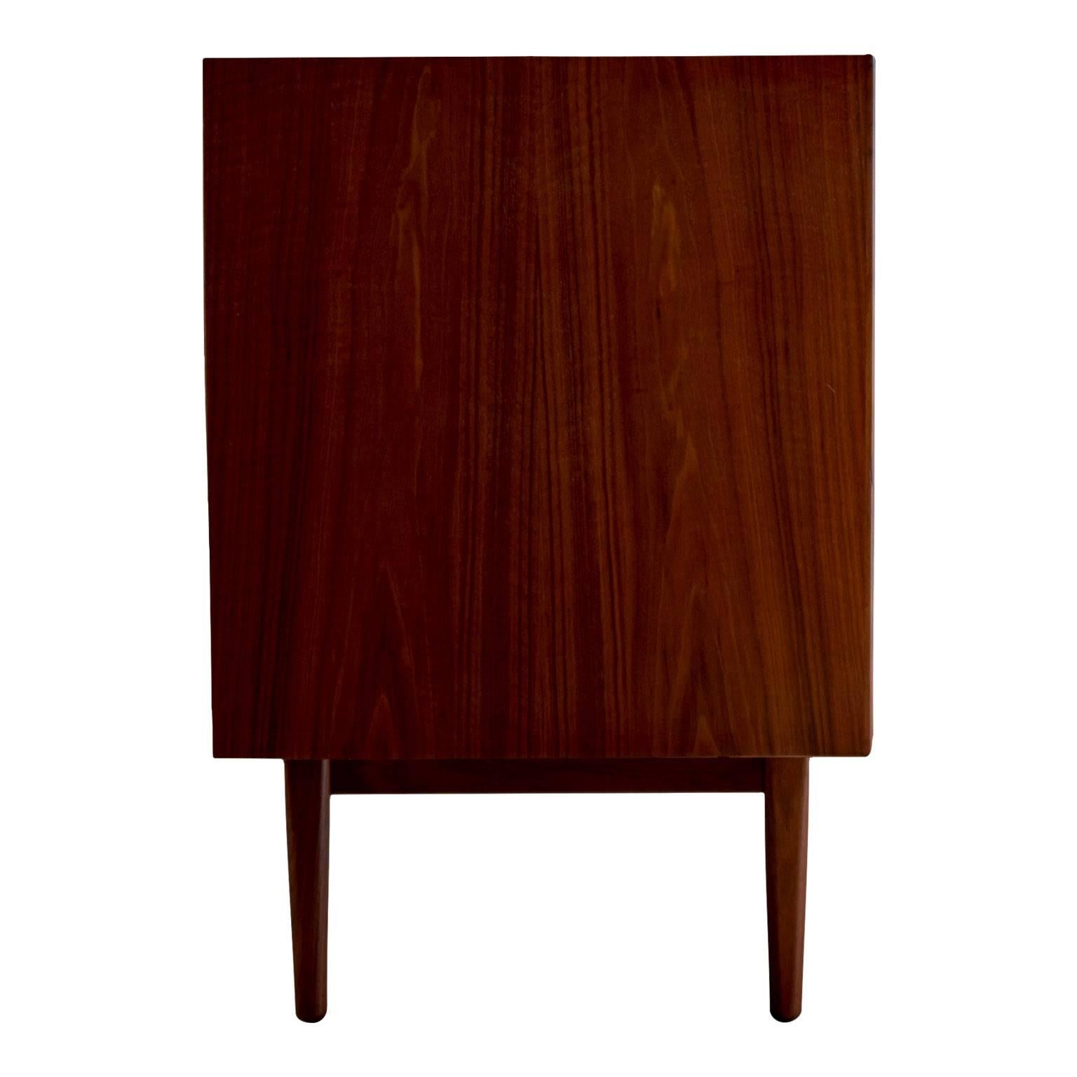 Exceptional Mid-Century Modern credenza designed by Kipp Stewart and Stewart McDougall as part of the Declaration line for Drexel furniture. Fabricated from veneered walnut with striking wood grain and dovetail drawers this beautiful credenza has