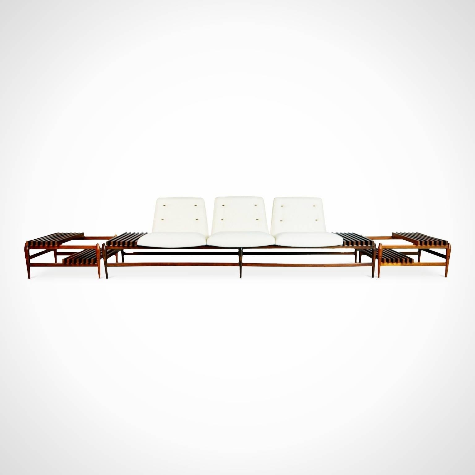 Newly imported and restored from a private collector in Brazil, this one of a kind sofa and two matching side tables were created by the Liceu de Artes e Ofícios de São Paulo and encapsulate the quality and innovation of the school's designs.