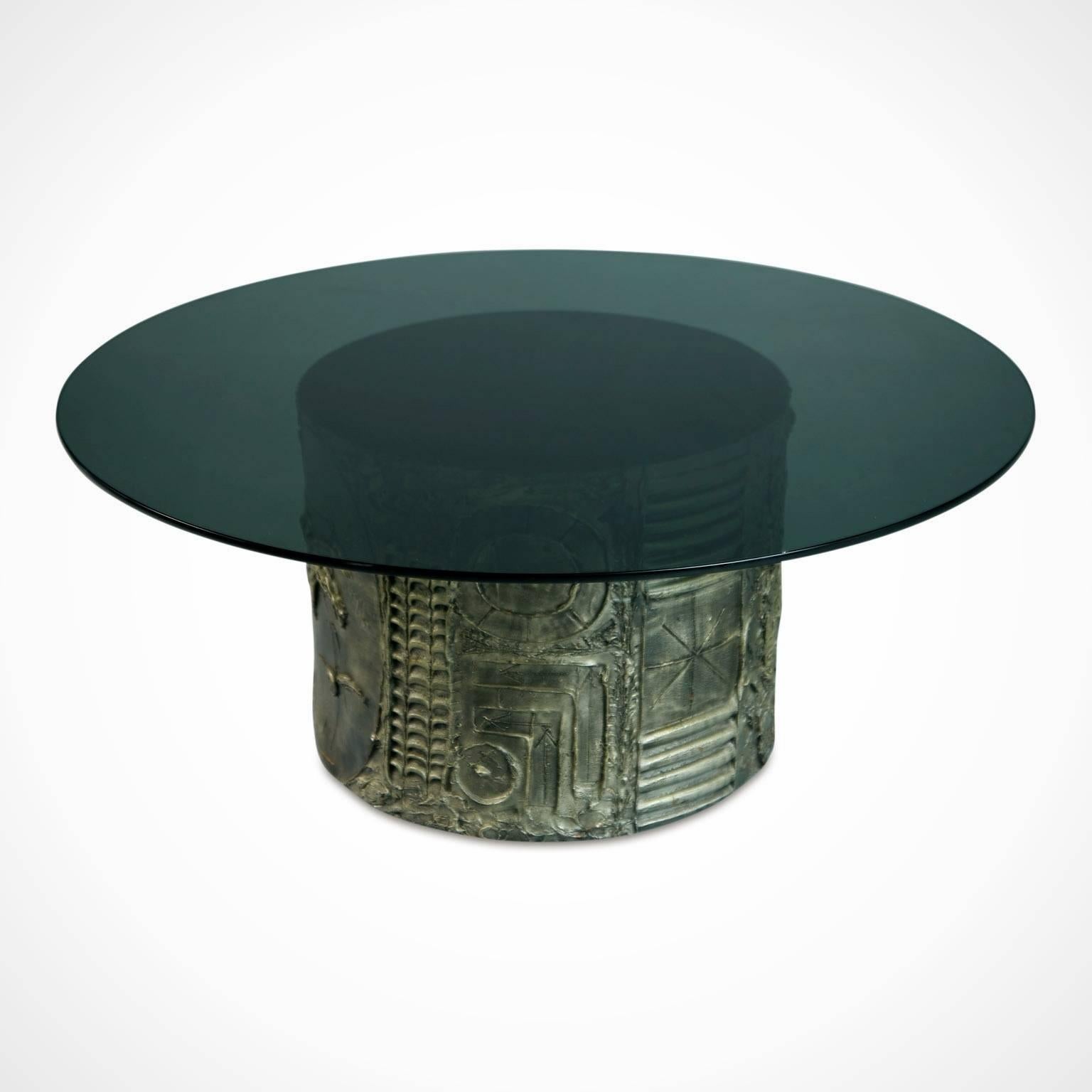 Brutalist style coffee table by Pearsall for Craft Associates. This coffee table is fabricated from pewter colored cast resin featuring Pearsall's signature etchings carved into the drum base and is topped with a broad, circular smoked glass