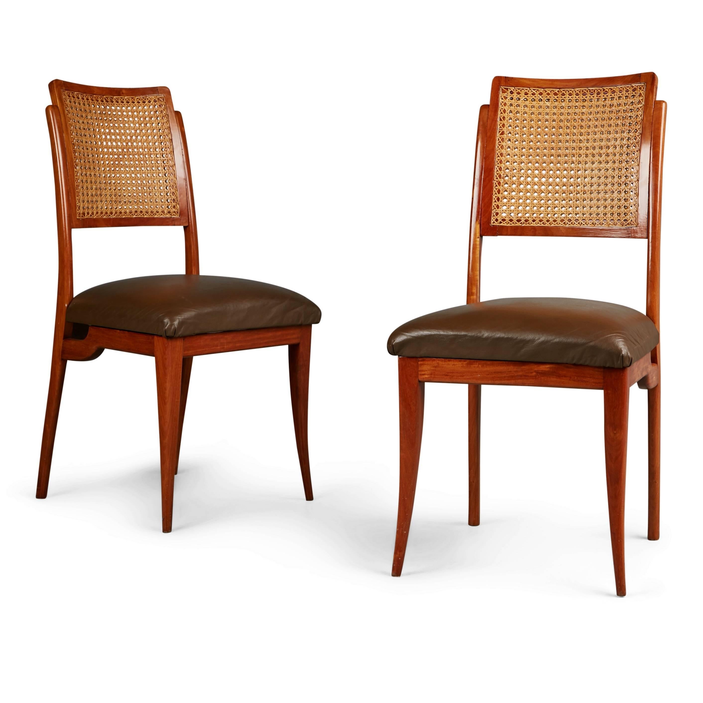 Newly imported from a private collector in Brazil, these extraordinary dining chairs embody the use of curvaceous lines and soft shapes that Scapinelli was well-known for. These sculptural dining chairs have been recently lacquered and are