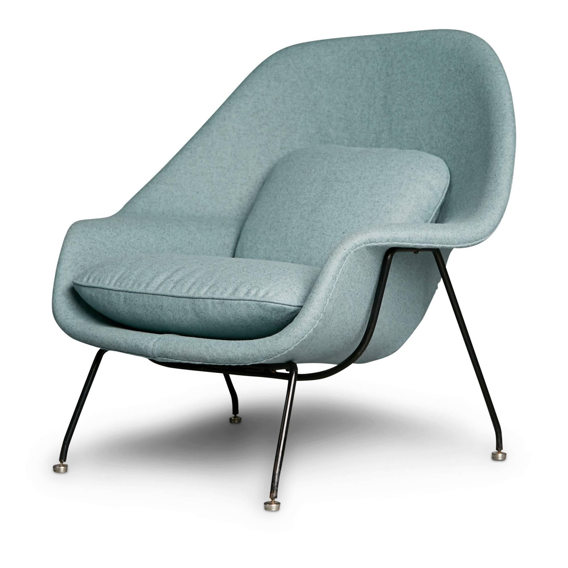 When Florence Knoll requested that Eero Saarinen design a chair like a basket full of pillows, the result was the ground breaking womb armchair. This iconic chair and has been newly upholstered in a beautiful duck egg blue wool with undertones of