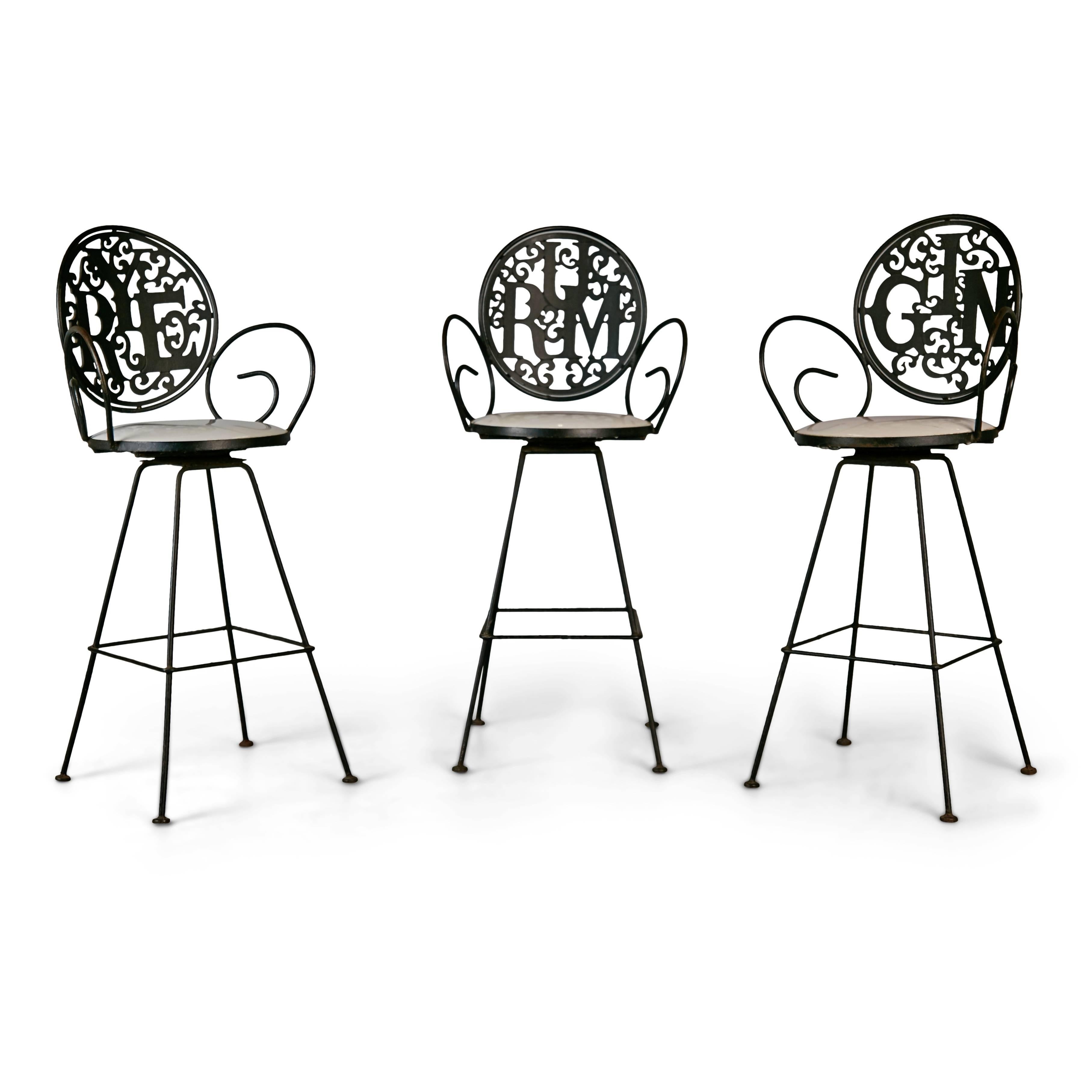 Pick your poison and then pick your seat, perching on one of these whimsical barstools by Arthur Umanoff for Shaver Howard. Conceived in the Pop Art style, these eye-catching stools are fabricated from wrought iron with the words 