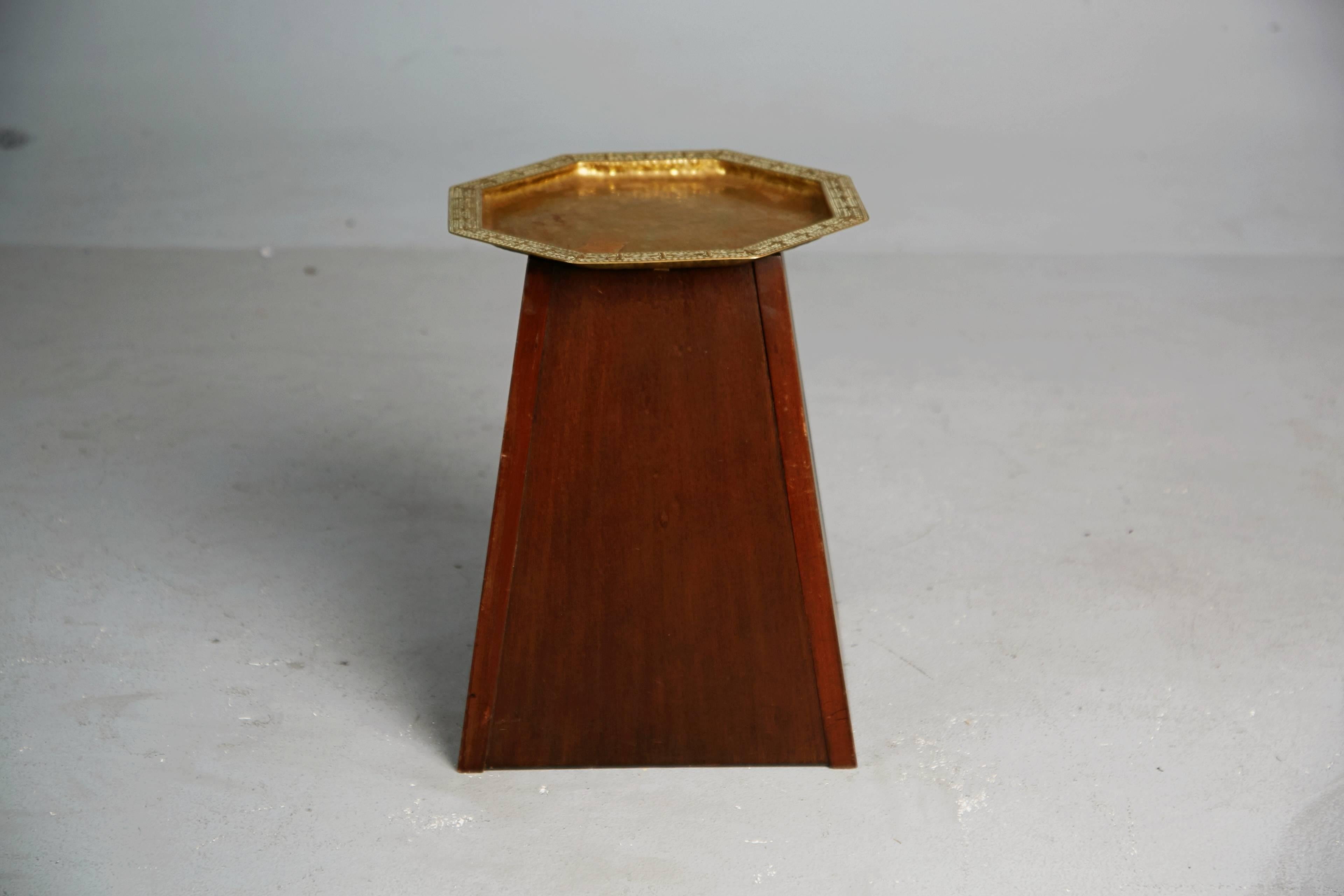 Expertly fabricated hand-hammered brass tray by German craftsman Georg Von Mendelssohn with mahogany stand, which was later added and affixed to the tray to create an attractive catch-all or side /end table. Mendelssohn's work opposed the declining
