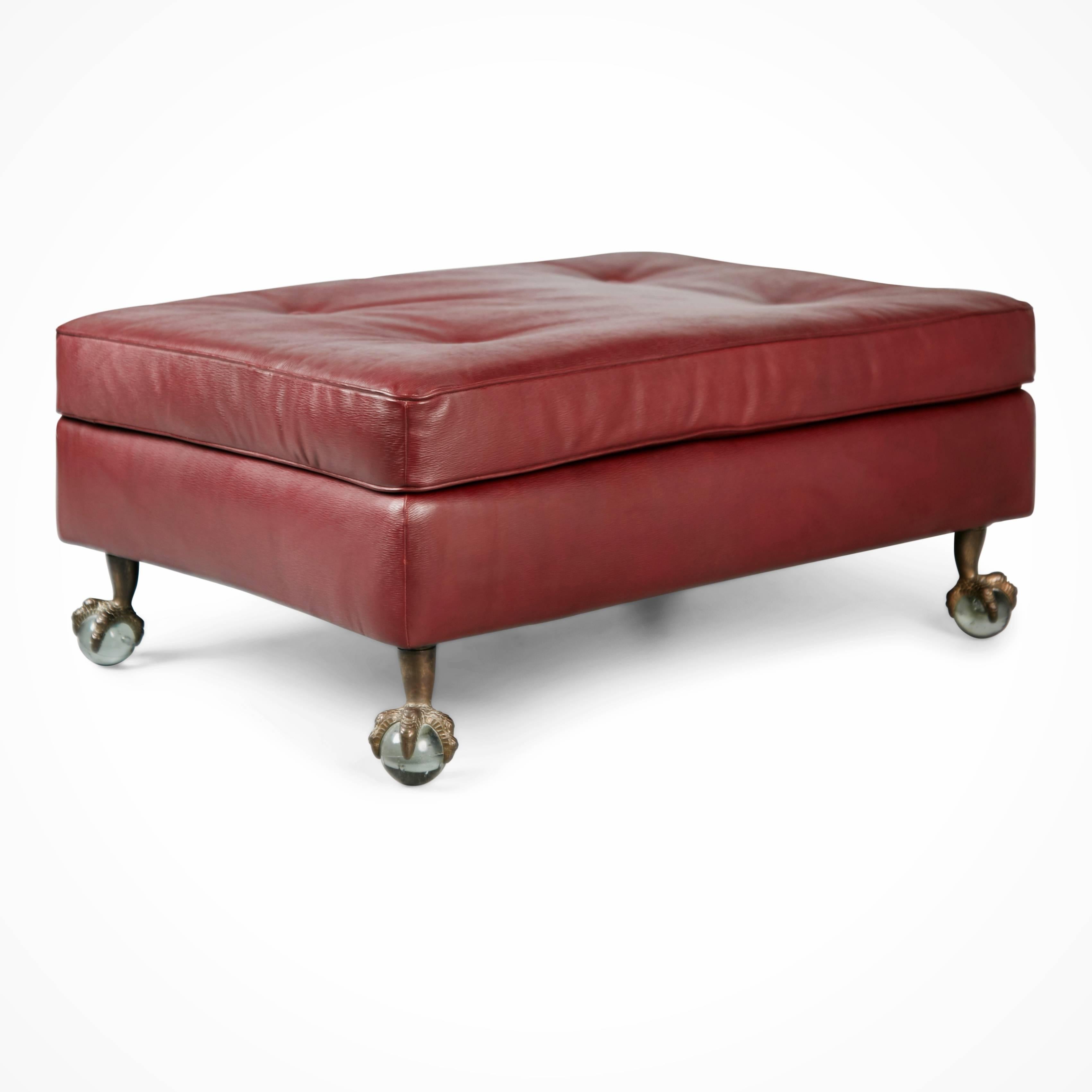 Classically designed tufted ottoman which has been upholstered in world-class Edelman Leather. This ottoman is upholstered in Edelman's Epi Leather 'Sulky' in the colorway Cabernet, a deep rich oxblood which displays a hand antiqued embossed