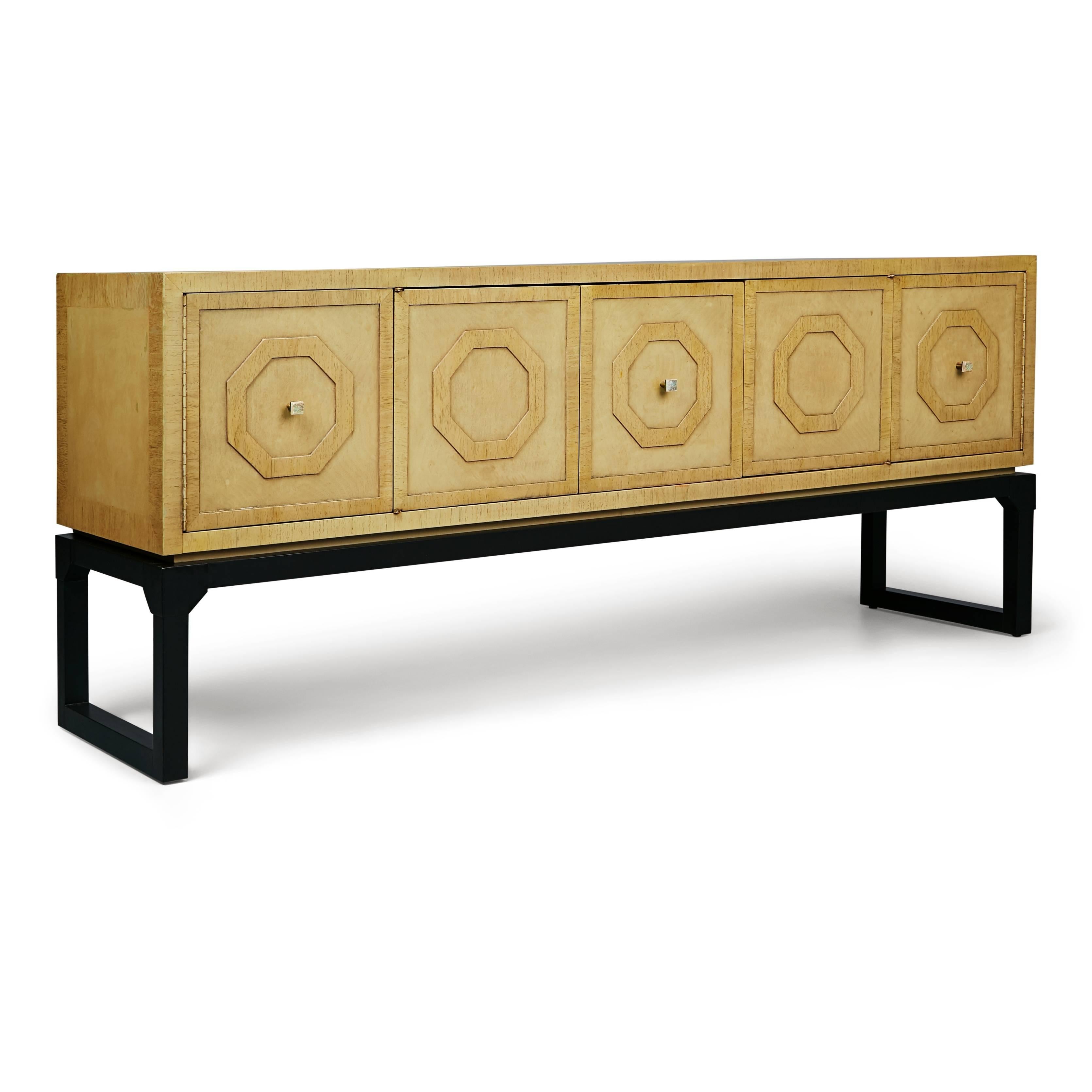 Elegant crafted credenza or sideboard by Romweber. This beautiful piece is fabricated from lacquered walnut which has been finished in a neutral bisque color and displays five panels on the front each decorated with a raised hexagon. Positioned in