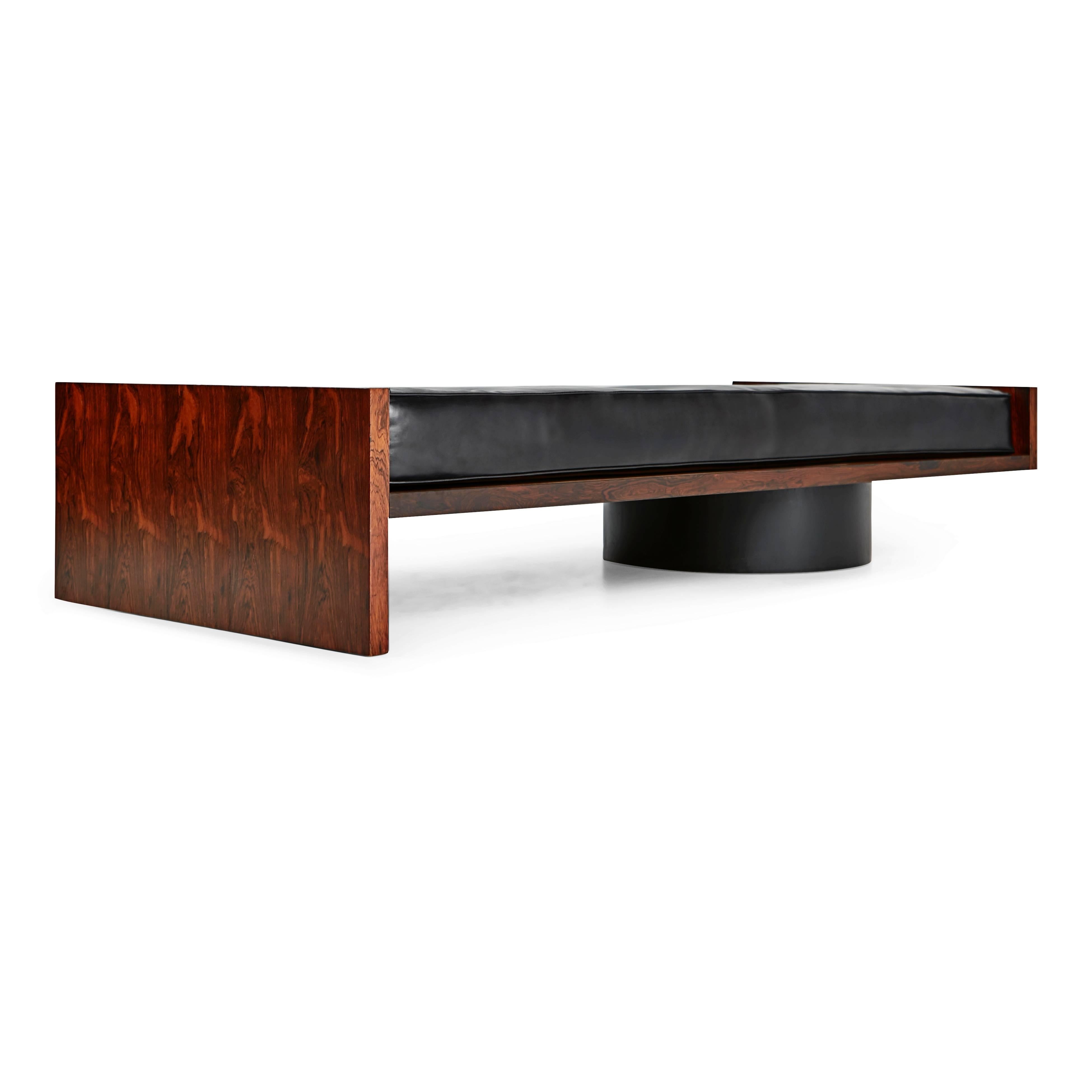 An incredibly unique jacaranda rosewood and black leather daybed designed by Joaquim Tenreiro. We recently acquired this rare find from a home in Rio de Janeiro, Brazil which was designed by Tenreiro in the 1960s. Most of the pieces in this home
