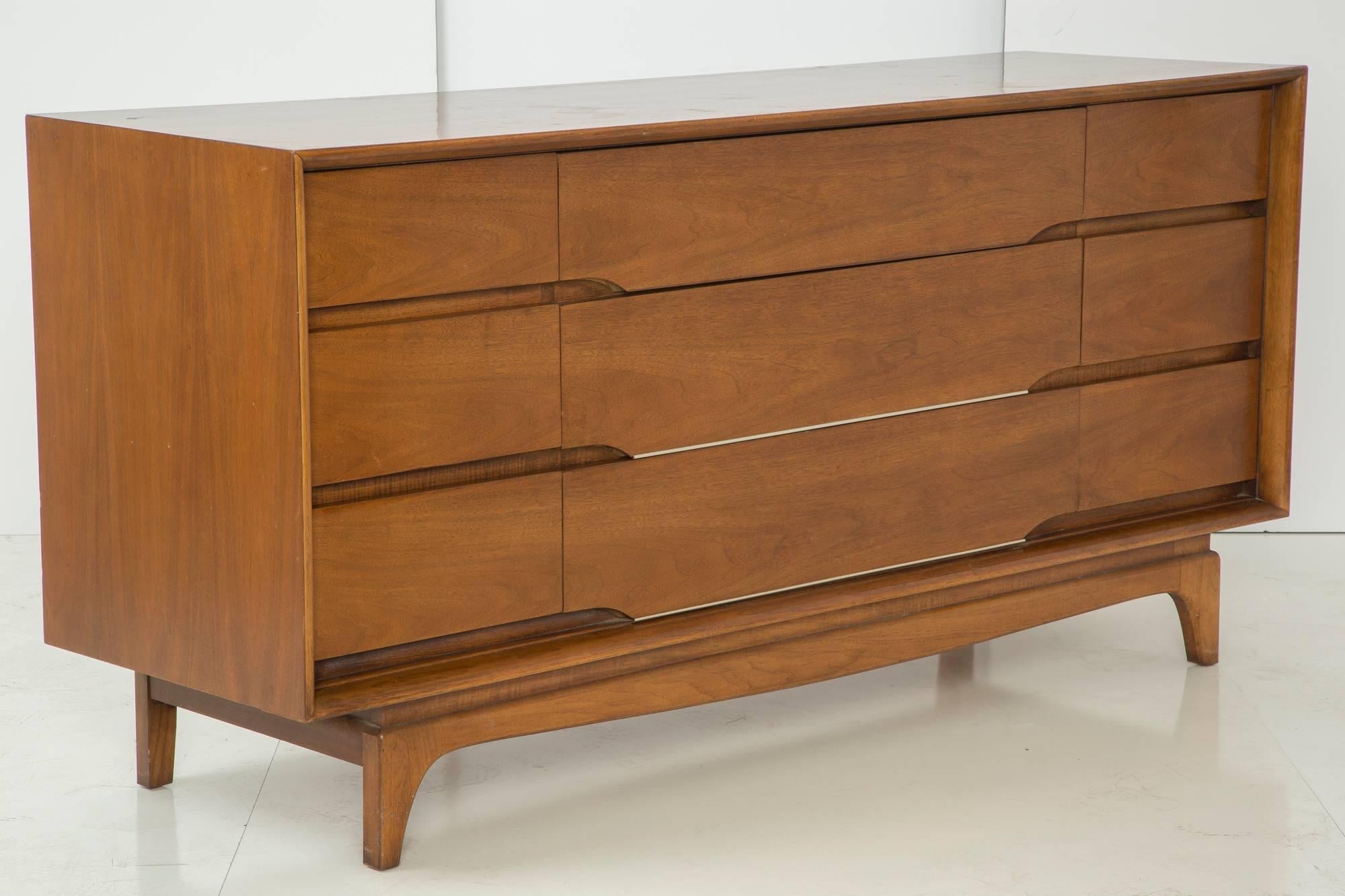 This beautiful Kent Coffey dresser is part of a beautiful Danish bedroom set which can be sold together for a lower price. Please inquire. Set includes the dresser featured in this listing, a chest of drawers, a mirror and a headboard. 

This
