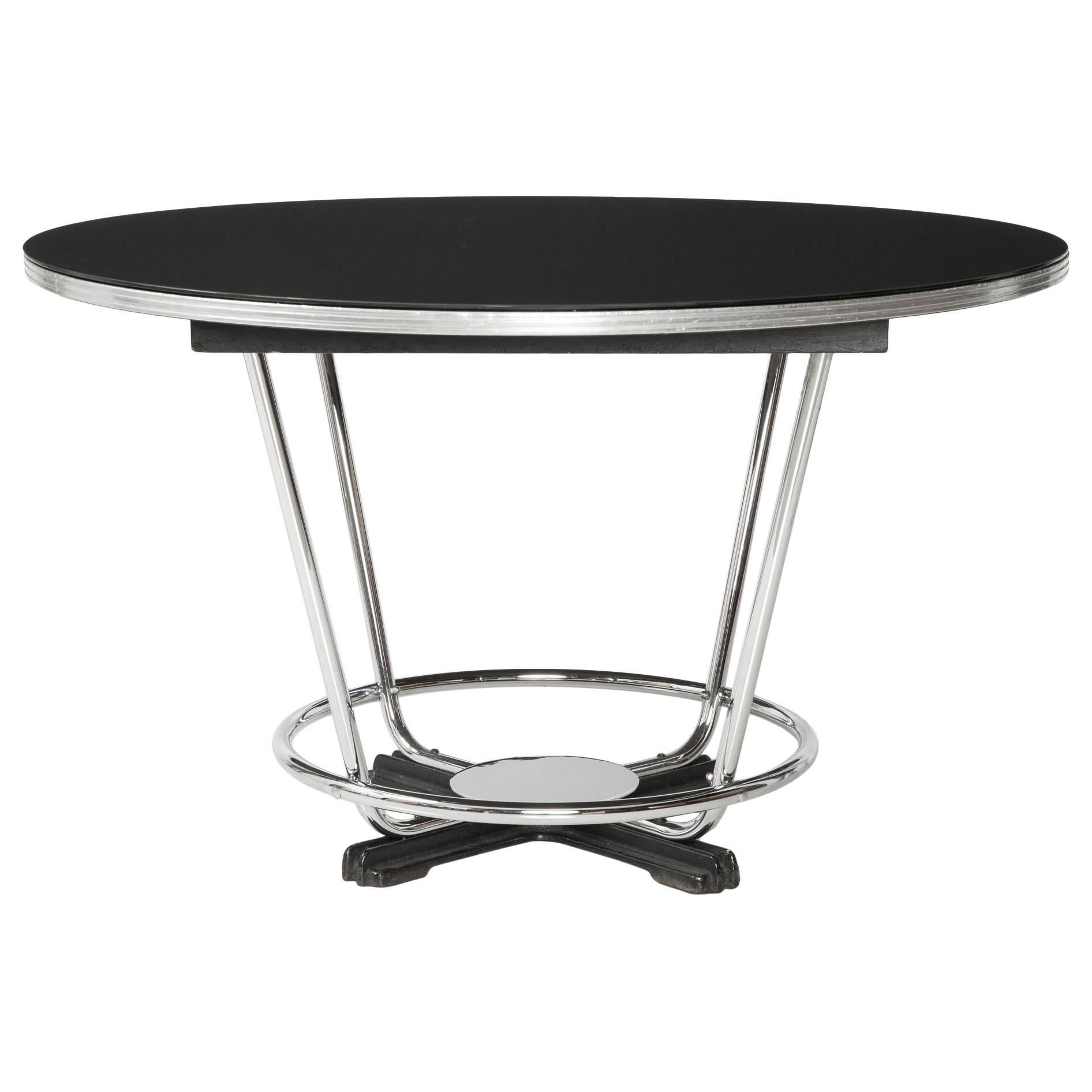 Beautiful Art Deco table, Donald Deskey attribution. Beautiful black glass top with a chrome frame and base - such an amazing and unique design to add to any retro breakfast nook.