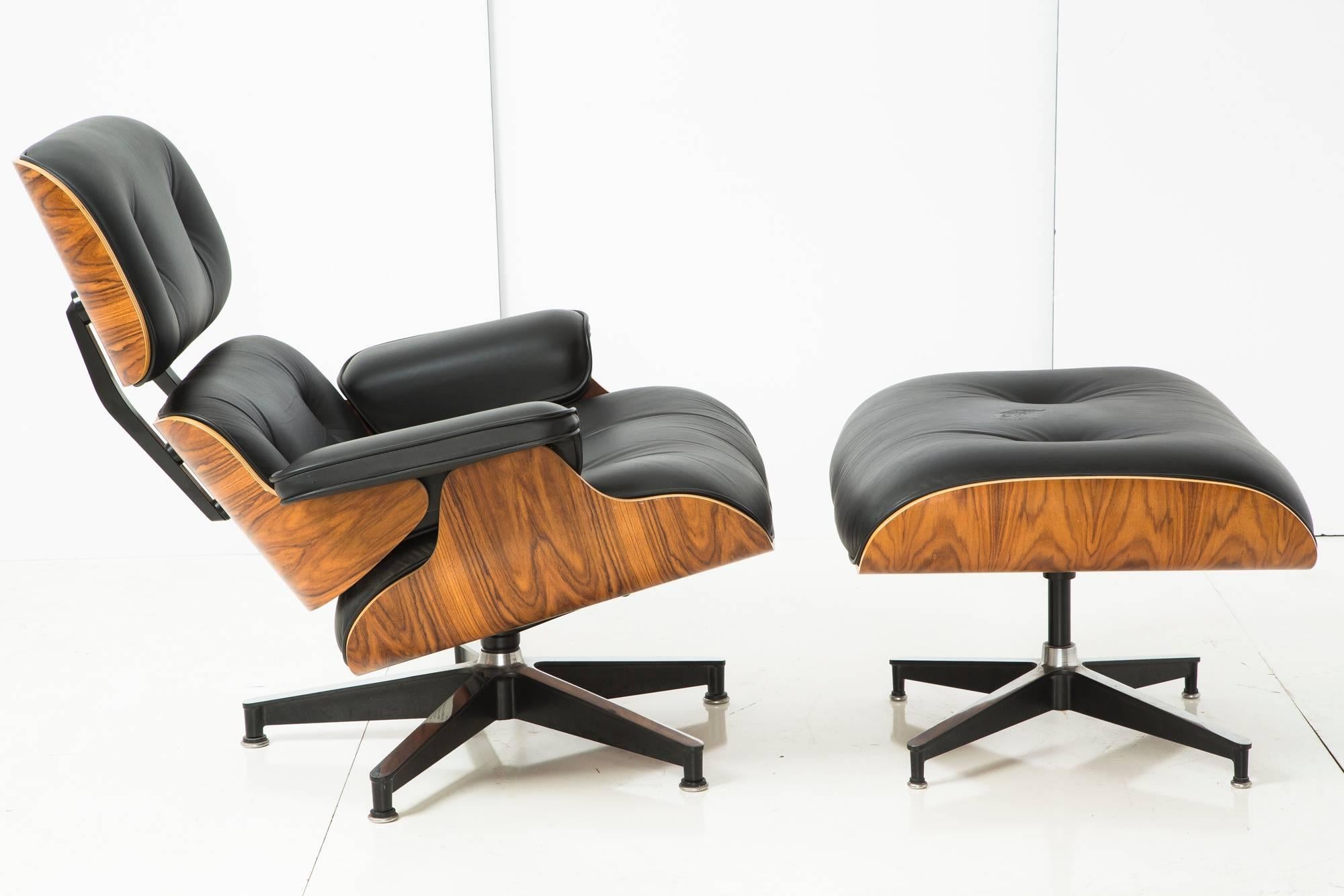 Eames Office celebrated the 50th birthday of the lounge chair, one of Mid-Century's most iconic designs, with this special edition production. Molded plywood frame with rosewood veneer and black leather upholstery.