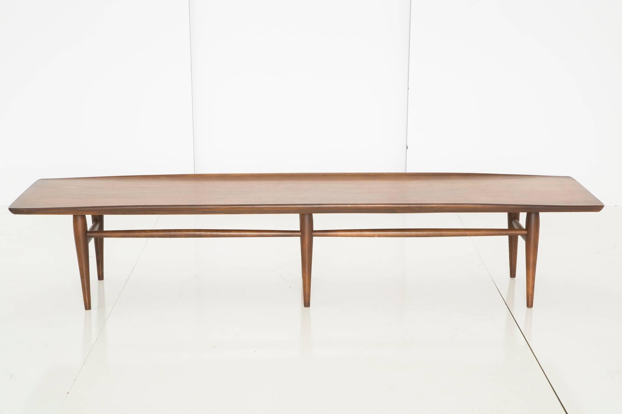 Lovely Mid-Century Modern coffee table with six tapered legs.
