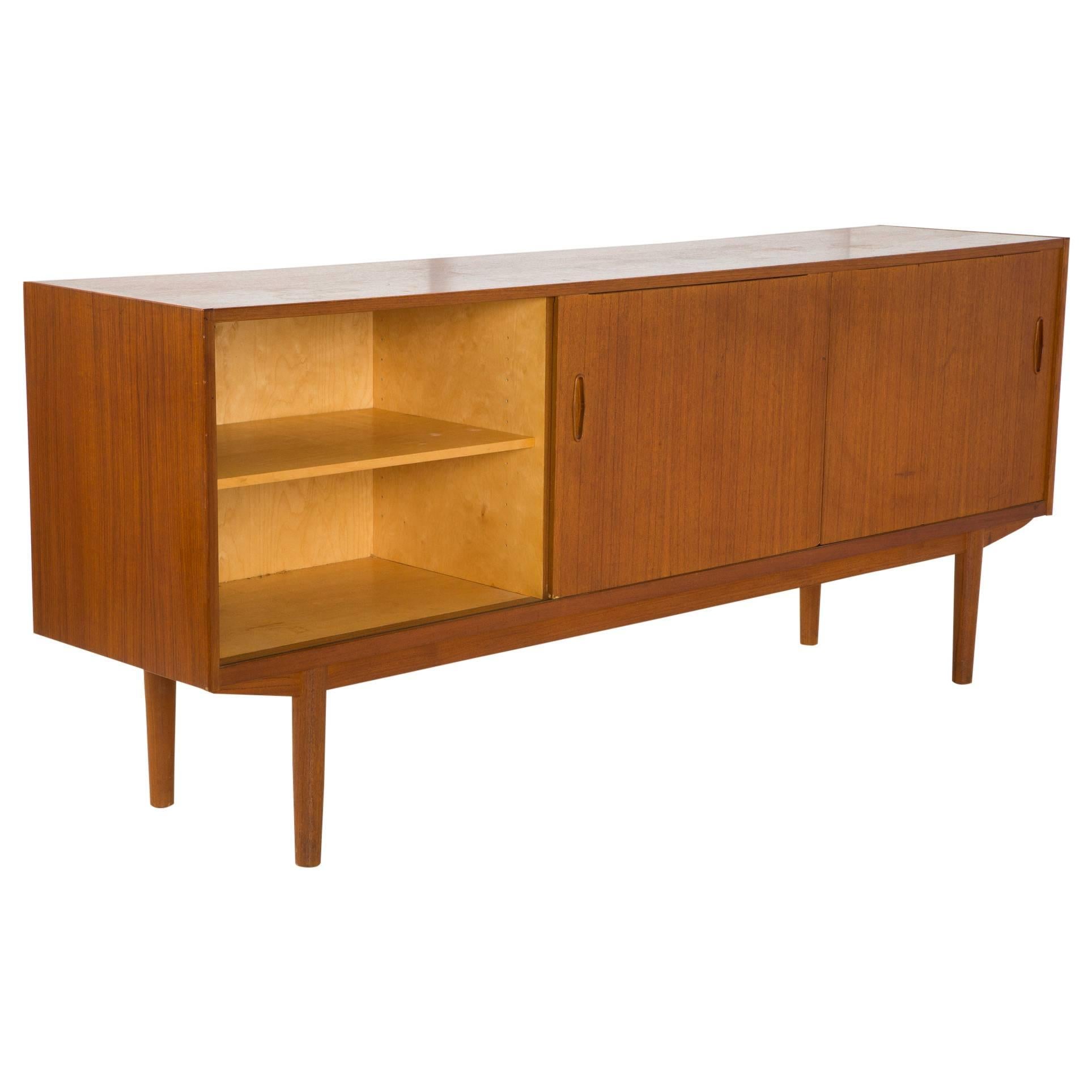 Gorgeous Mid Century Modern Credenza with louvered design. Two doors on each side with birch interiors and removable shelves. 4 drawers in center that open and close nicely. Top drawers has blue felt with dividers. Troeds Bjarnum made in Sweden logo