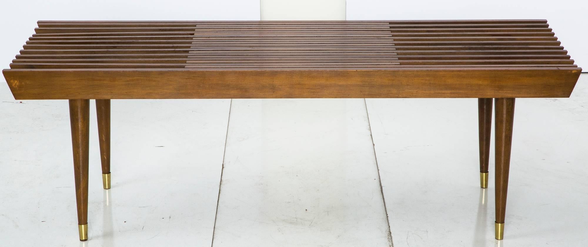 Sweet Mid-Century Modern expandable bench! Tapered legs and brass capped feet. 60