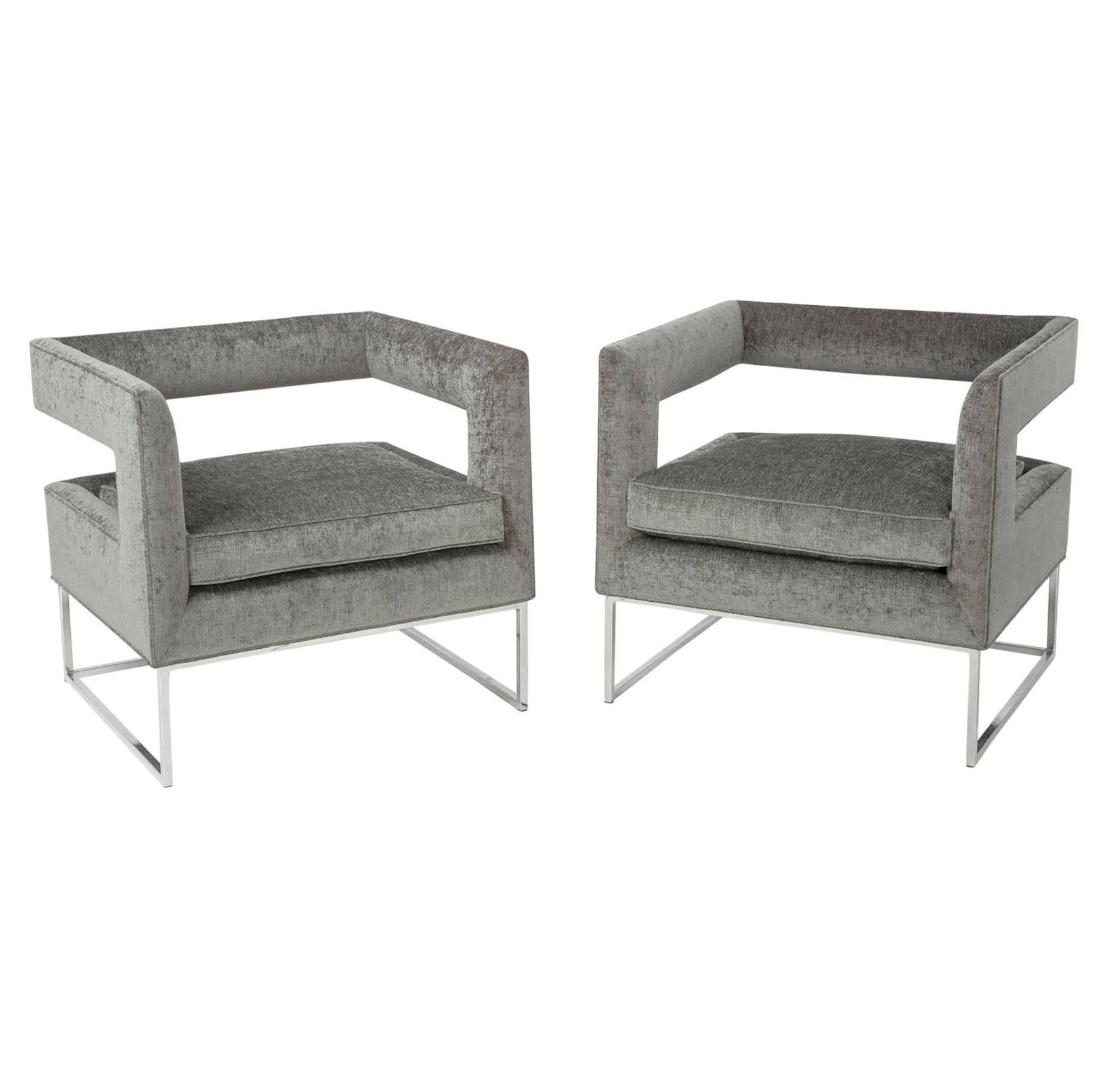 Meticulously and expertly restored in a soft and luxurious chenille, this pair of grey floating cube chairs by Milo Baughman is ready to be placed into any high end home, office or studio.

The chrome base is in excellent original condition and is