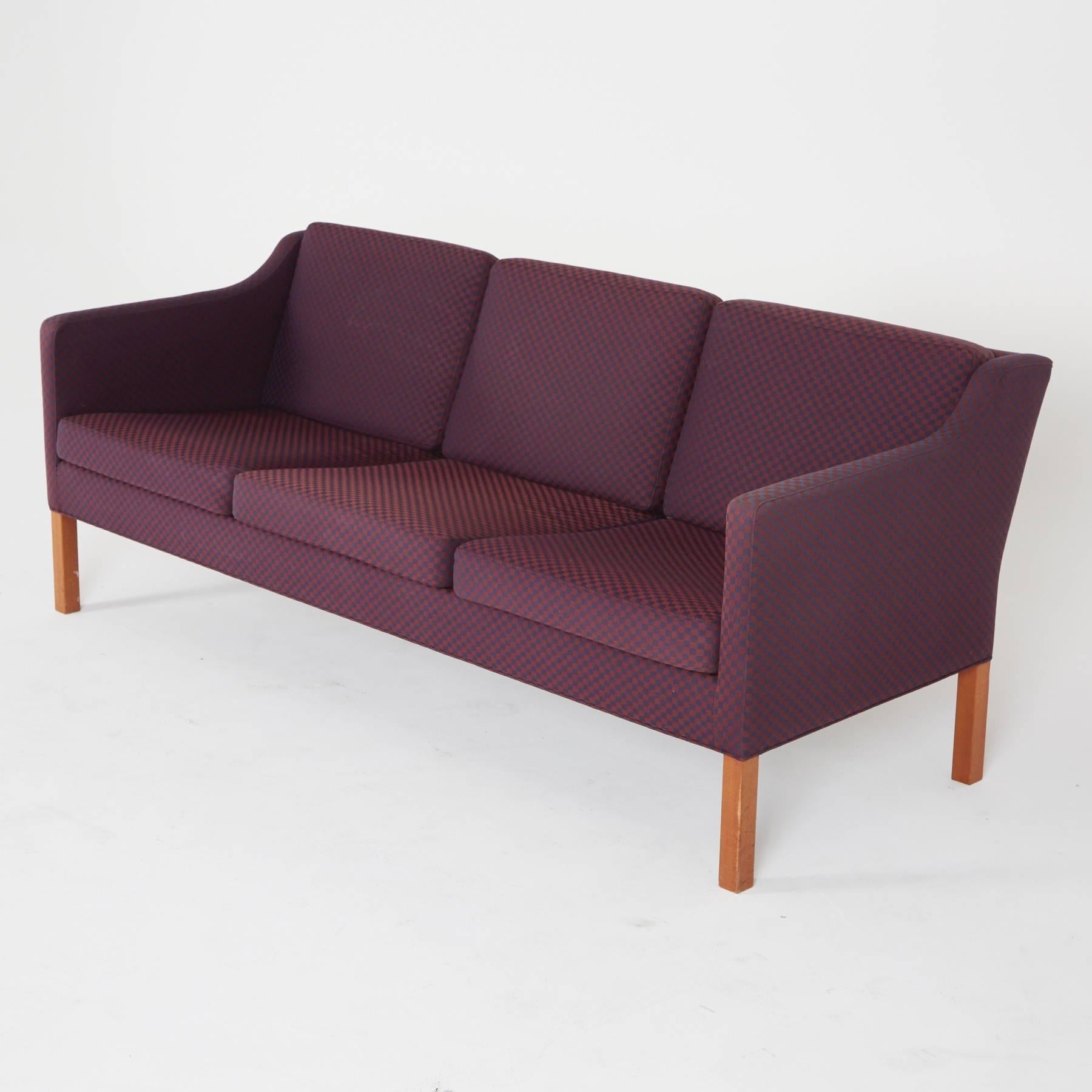 Designed by Børge Mogensen for Fredericia Stolefabrik, original label is intact under the sofa.

This Danish modern sofa is part of a matching living room set, the chairs for which are also available for sale on our storefront. Poised armrests