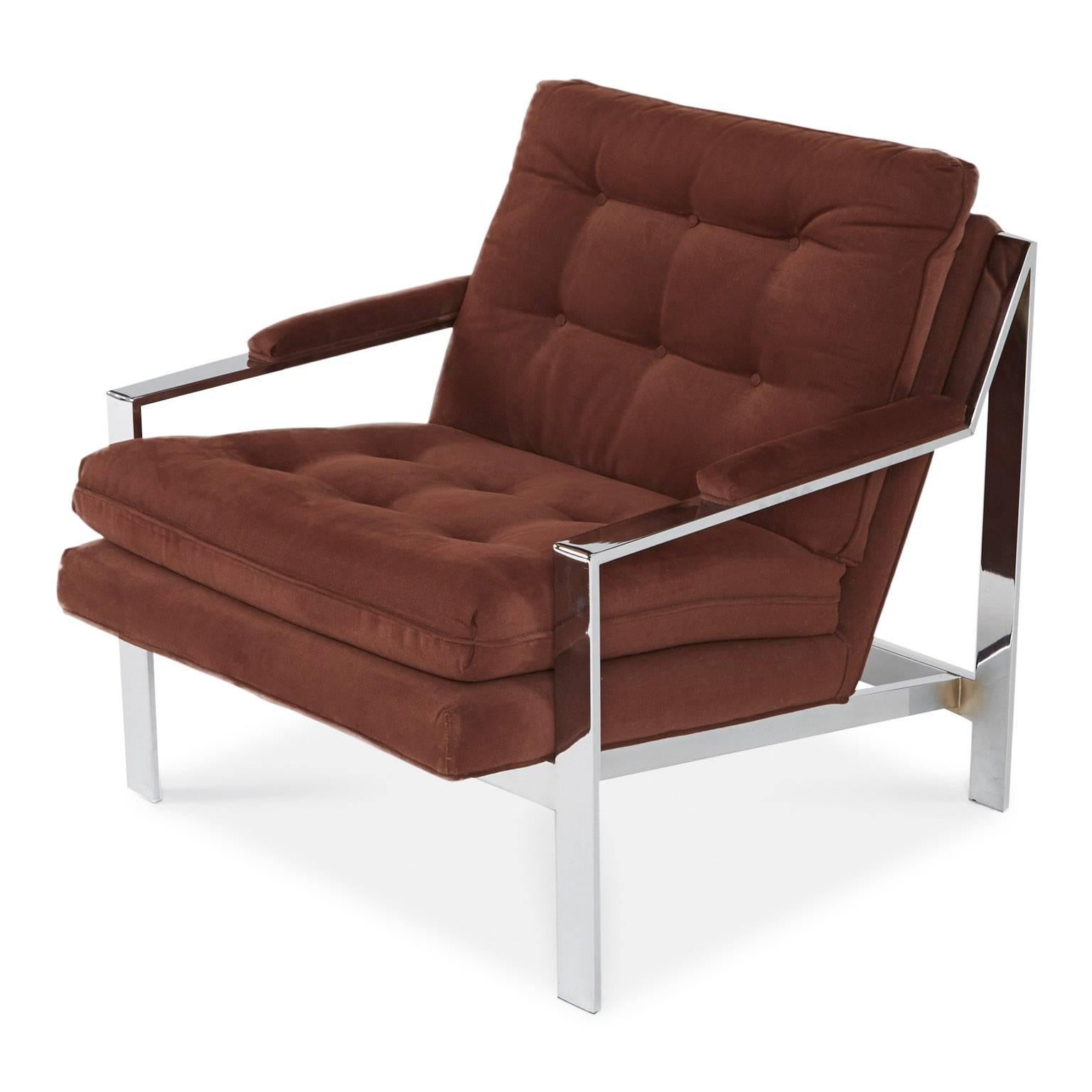 Designed by Cy Mann for Cy Mann Designs Ltd New York, this sleek club chair parallels Milo Baughman's recognized designs and attests to be an equal icon for Modern lounge seating.

With squared chrome frame and original tufted deep rust colored