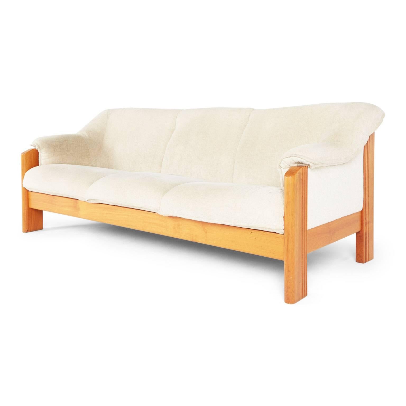 Three-seat sofa with solid Norwegian teak frame and original textured vintage fabric produced by J.E. Ekornes, one of Norway's leading furniture manufacturers. The gently organic design of this piece is both comfortable and supportive, perfect for