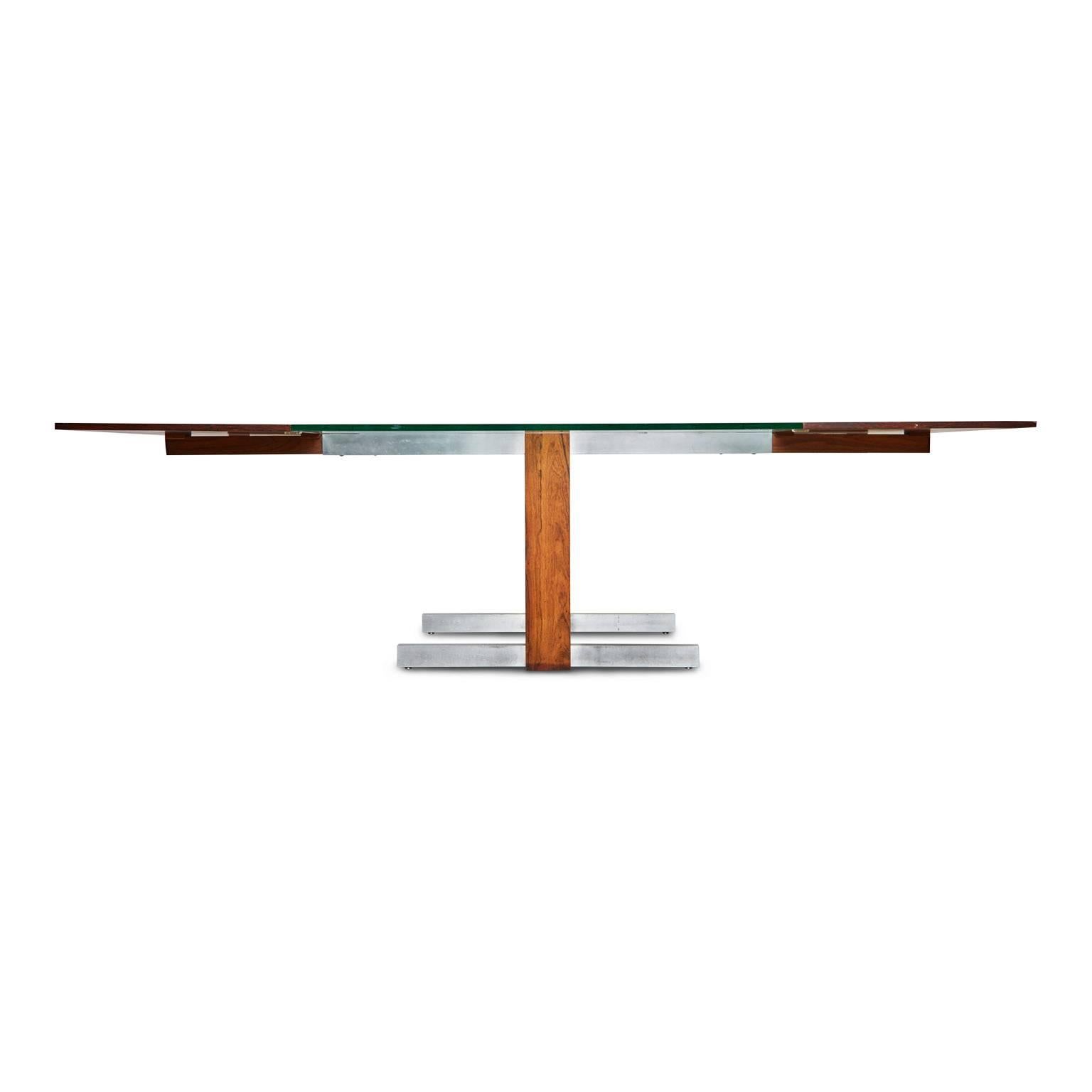 The sleek modern design of this innovative cubist table by Vladimir Kagan makes this piece as relevant and prominent today as it was when first issued. The versatility of this piece allows for it to be used as a compact glass table, or fully