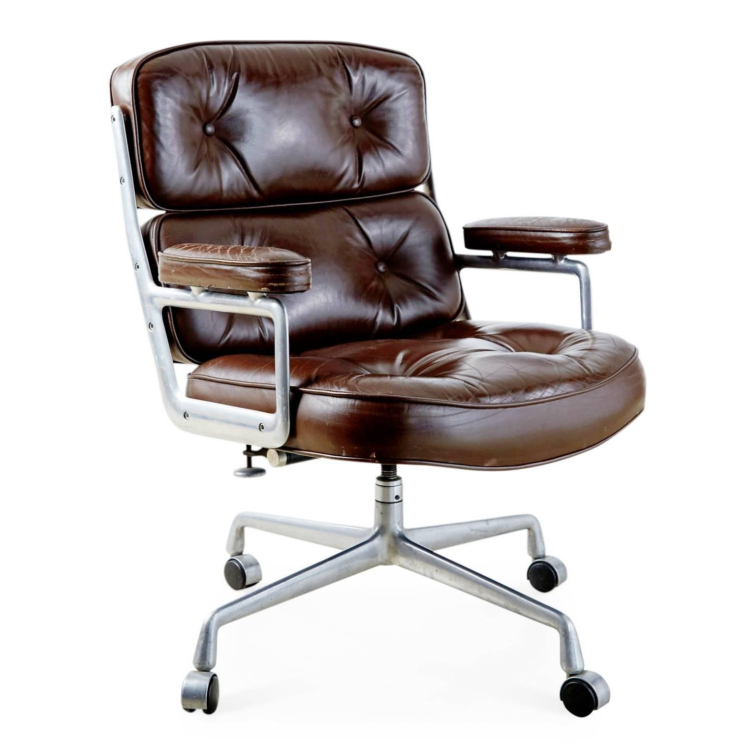 Designed by Charles Eames in 1959 for the Time Life building in New York City, this executive office chair still claims its tenure as the pinnacle of professional style. 

Upholstered in a deep chestnut brown leather that features an admirable