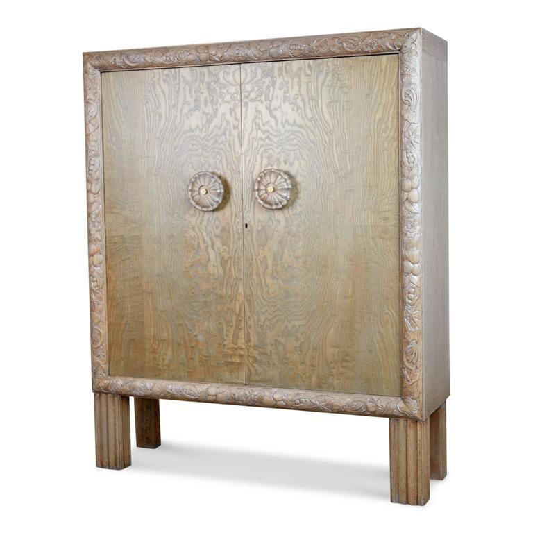 Exquisite newly refinished Gustavian style highly detailed carved Circassian Oak cabinet from France, Circa 1920. 

Fabricated from solid Circassian Oak with a carved border of flora, fruit and foliage, rosette style pulls with central cream