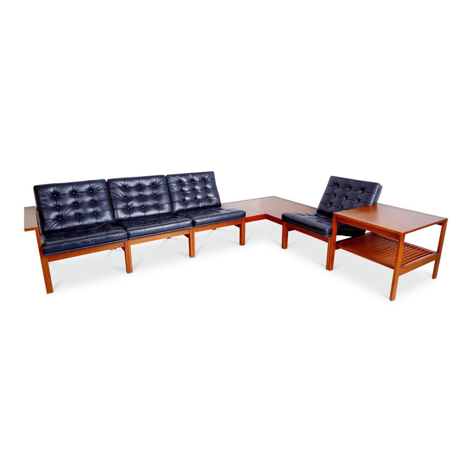 Newly restored Moduline living room set originally designed in 1962 by Ole Gjerløv-Knudsen & Torben Lind for France & Son. The teak tables and seating frames of this modular set were recently refinished and the seat cushions were newly reupholstered
