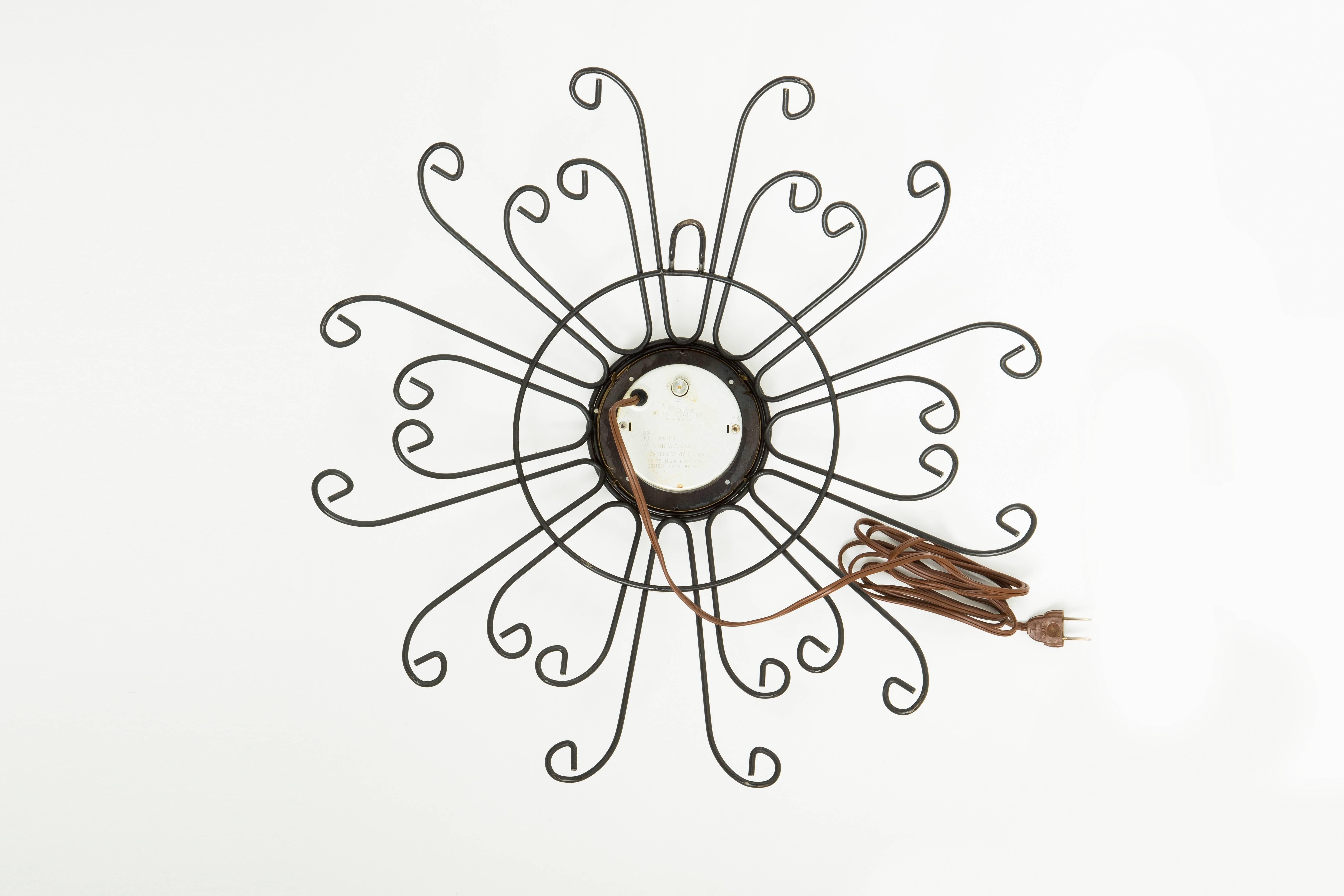 Wonderful ornamental starburst clock by Lanshire. Featuring curled powder coated sunbeams that decorate the perimeter. Roman numerals, electric cord and plug.

The archetypal design makes this clock appropriate for a number of locations, from
