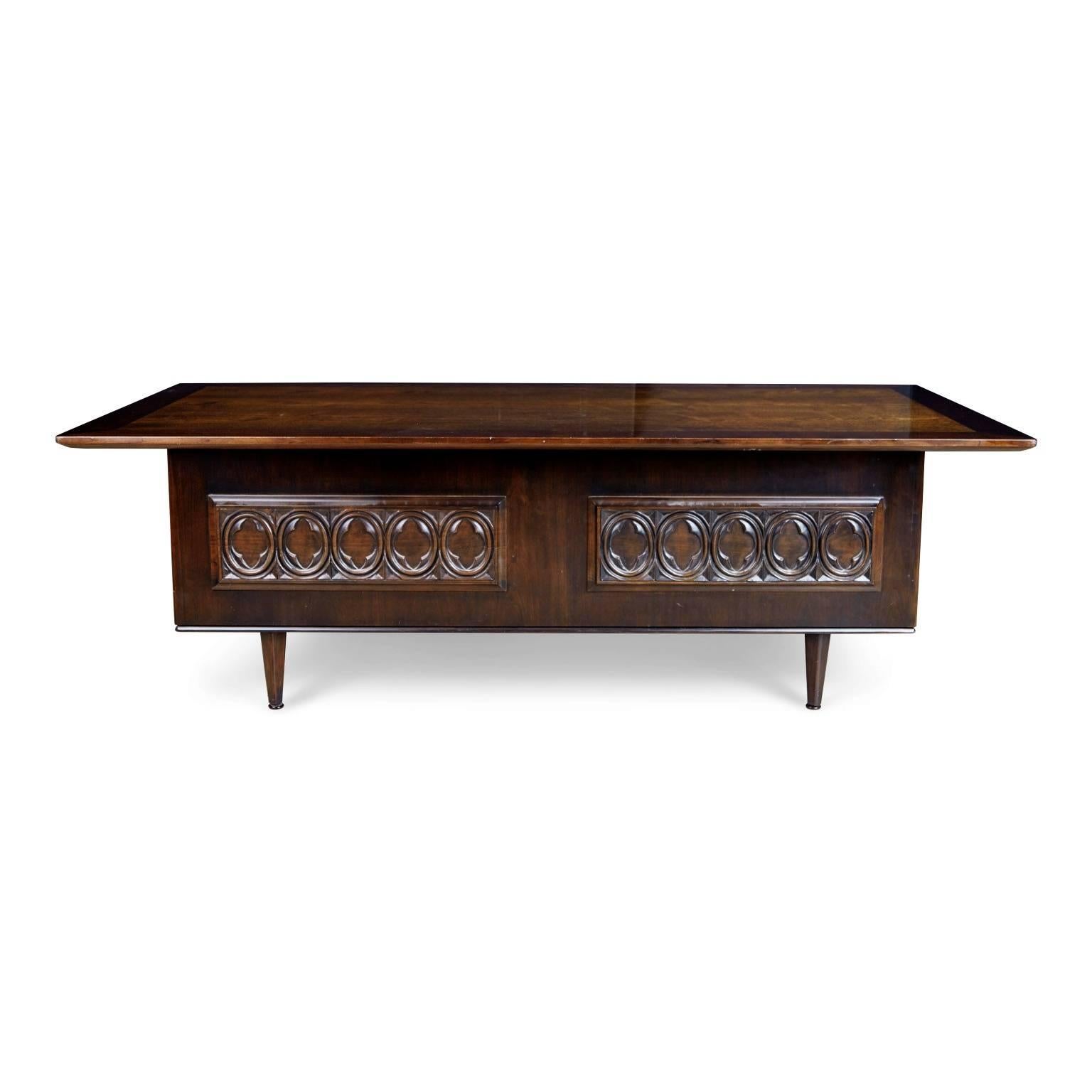 Monteverdi-Young were renown for their application of the Italian modernist movement in their designs and pairing this with old-fashioned craftsmanship, both of which these notions are evident in this expansive executive desk. The desk has three