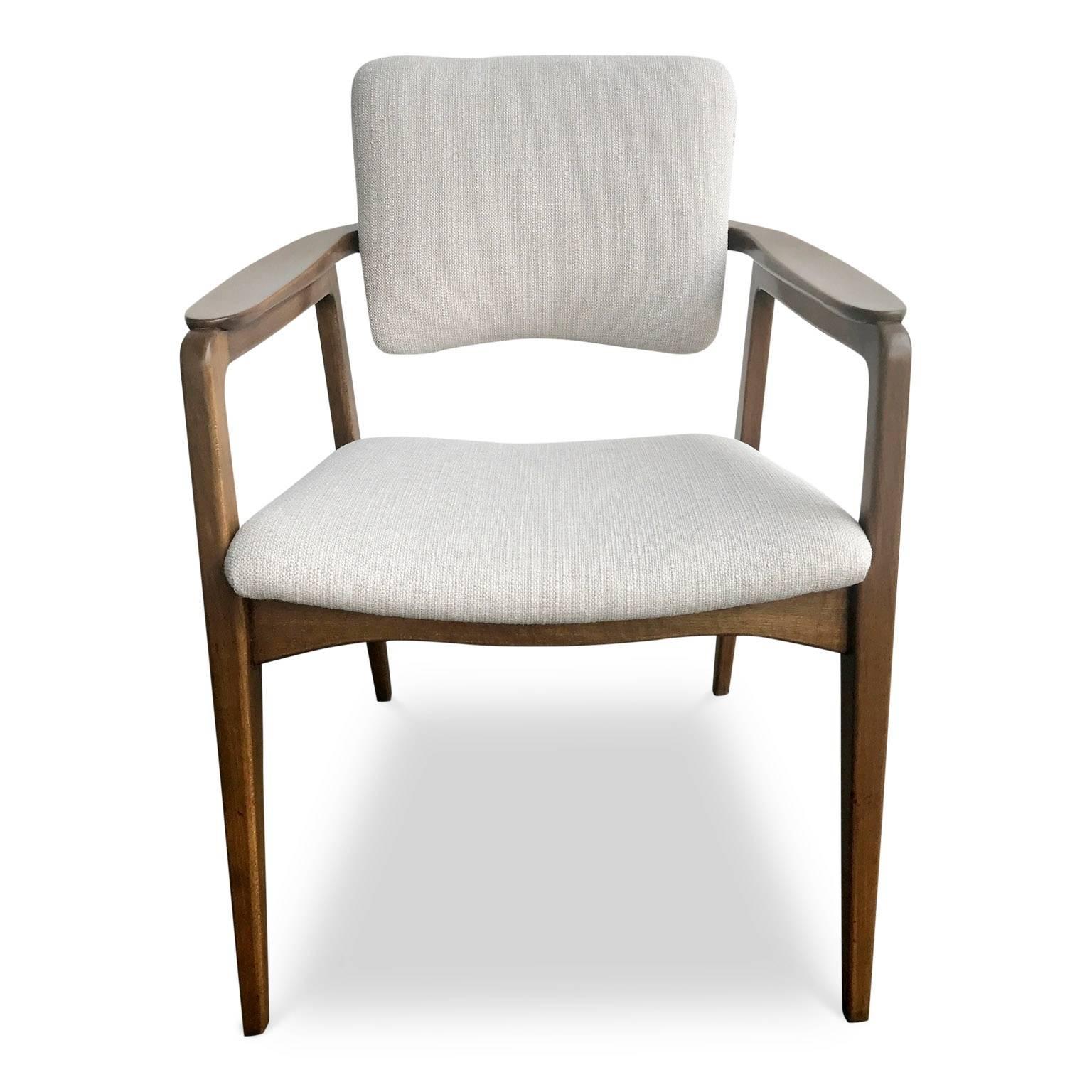 Elegant pair Sigvard Bernadotte tilt back chairs for France and Daverkosen Denmark, distributed by John Stuart. These graceful chairs have been newly restored. The solid teak frames have been refinished in a rich stain and the seats and backs have