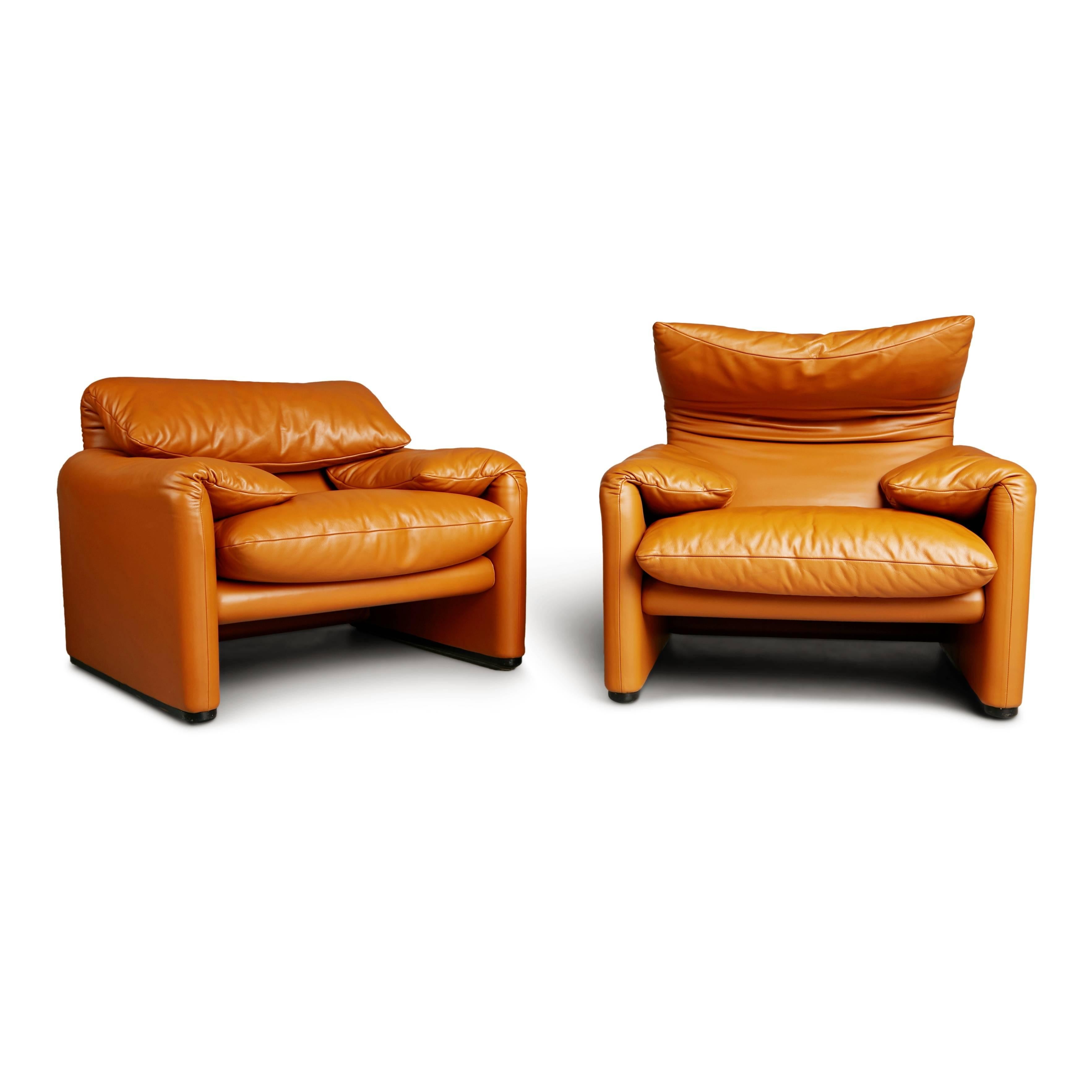Wonderful pair of Vico Magistretti's award-winning 1973 Maralunga chairs for Cassina. Featuring the original sumptuous tan leather upholstery which has been kept in excellent condition and shows an admirable patina. These traces of age and use bring