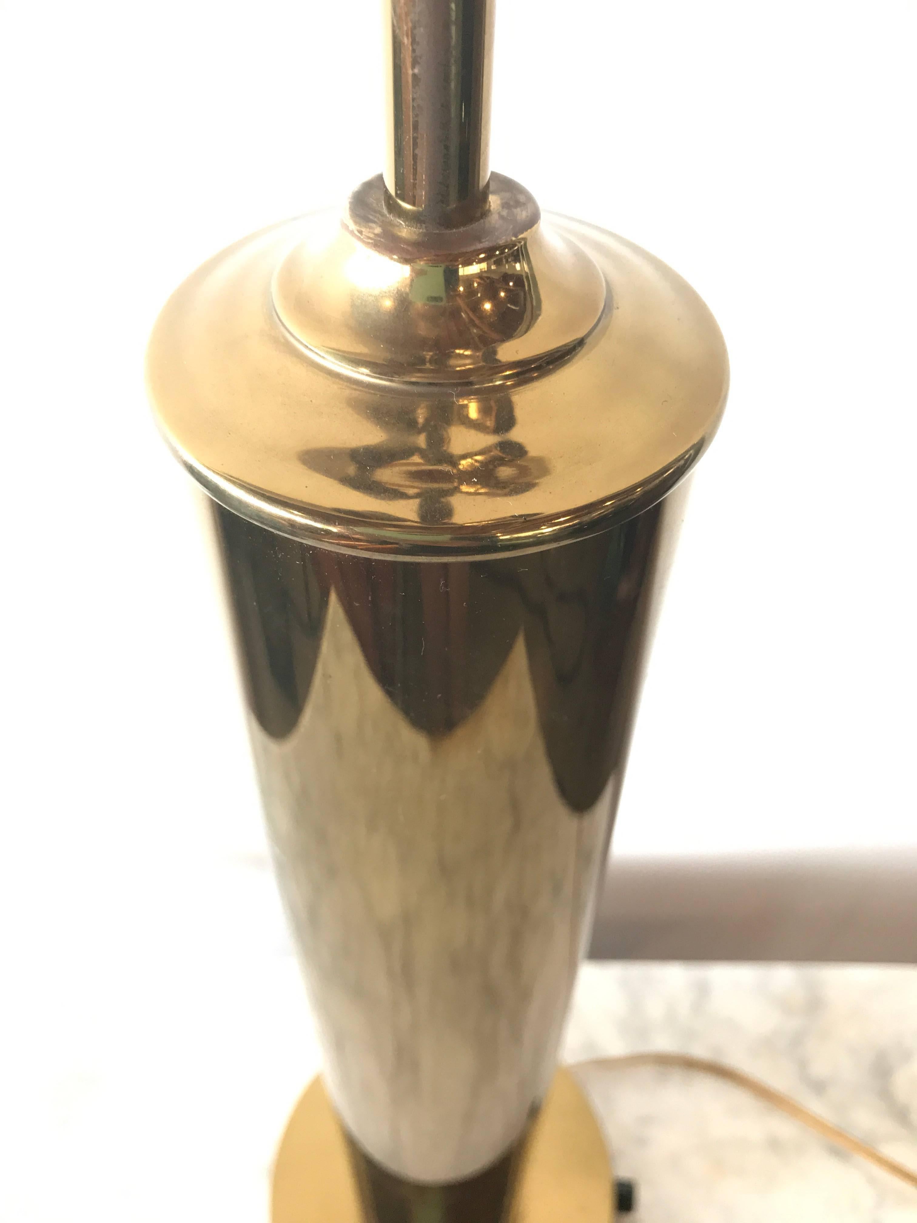 Get your hands on some highly coveted brass, one of the current top trends, with this tall and slender table lamp. The simple clean lines make this piece highly adaptable to fit into a number of spaces and fulfill many lighting needs. 

This table