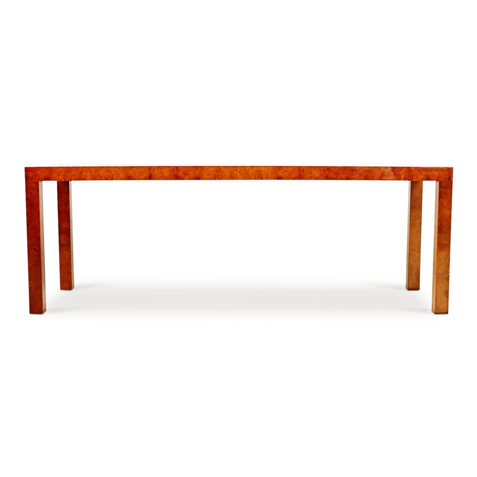 Elegantly crafted console table, media table or sofa table (depending on how you wish to use it) by Milo Baughman for Directional, circa 1980. Comprised of burled walnut veneer with beautiful grain variation. The veneer at the front features a