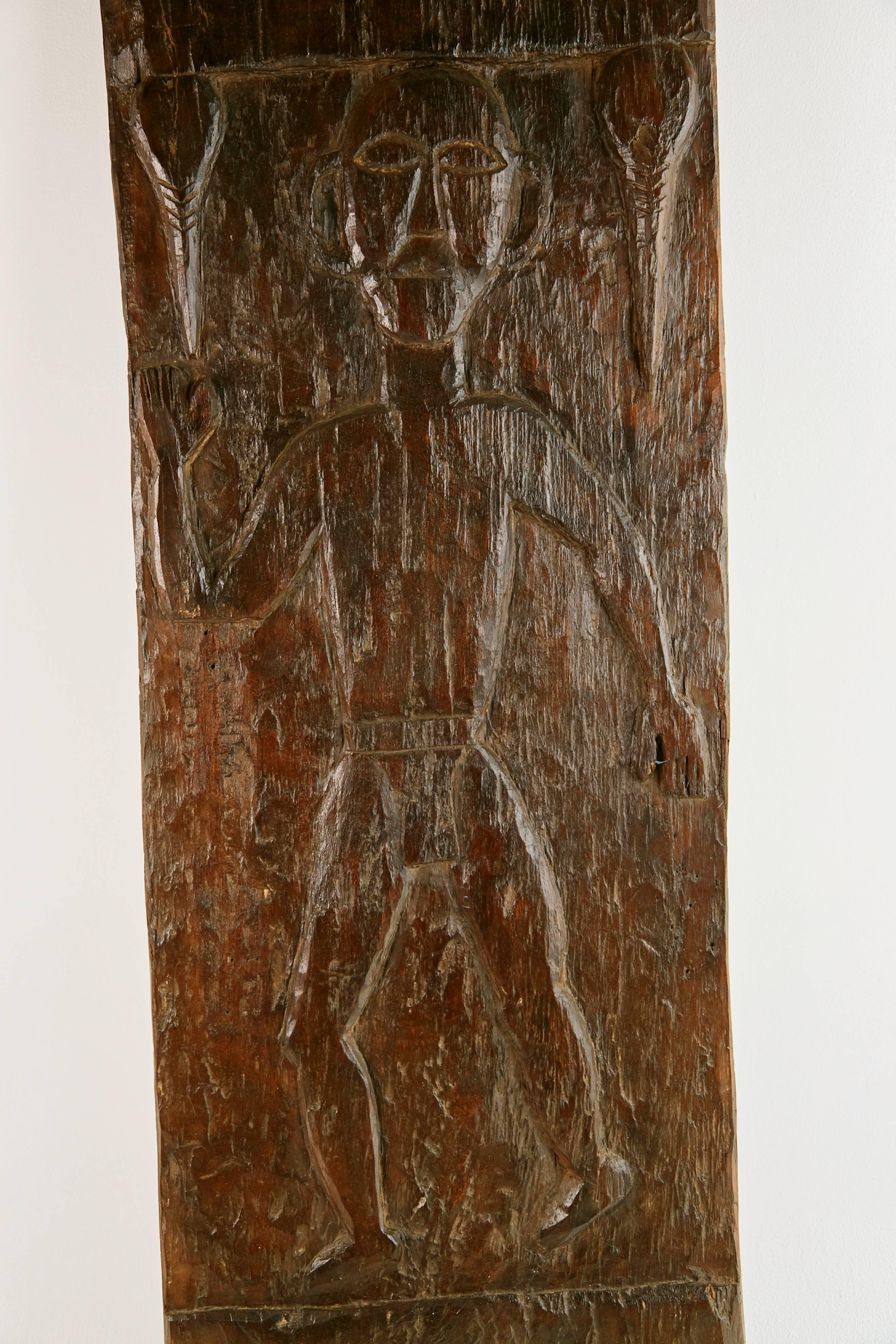 Primitive African Wooden Granary Door with Carved Motifs and Sculls