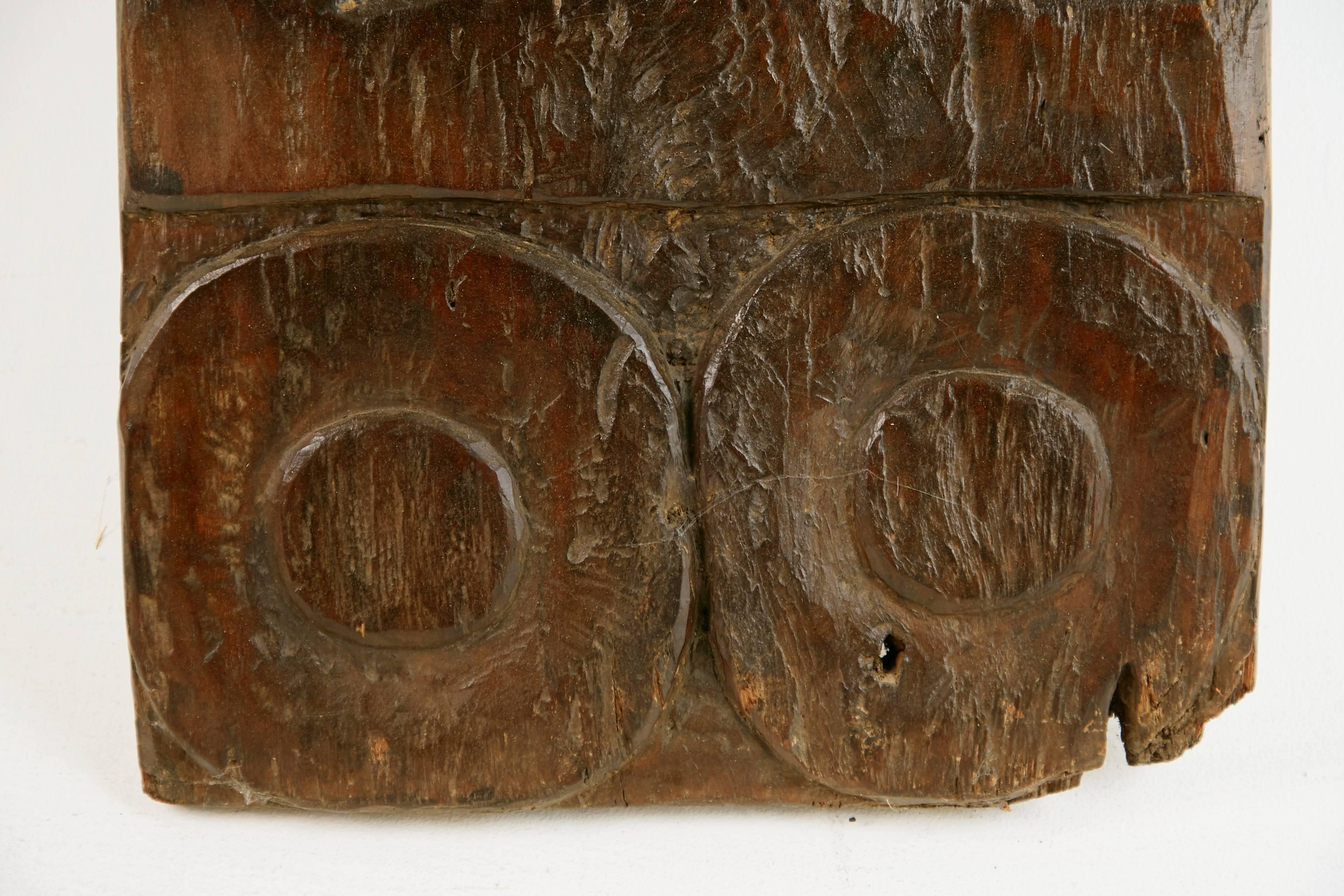 Hand-Carved African Wooden Granary Door with Carved Motifs and Sculls