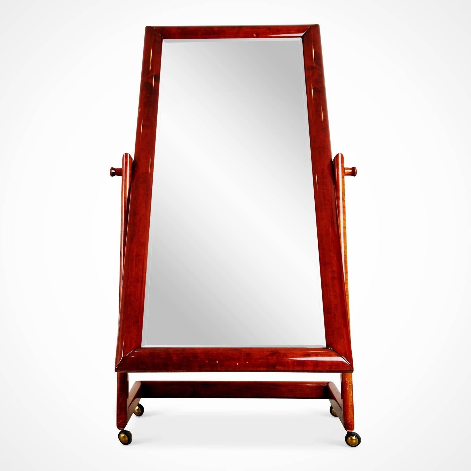 Elegantly executed modern Italian cheval standing mirror. This full length floor mirror rotates smoothly and is able to accommodate many alternate angles while dressing, which can be adjusted using by using the substantial knobs on either side. The
