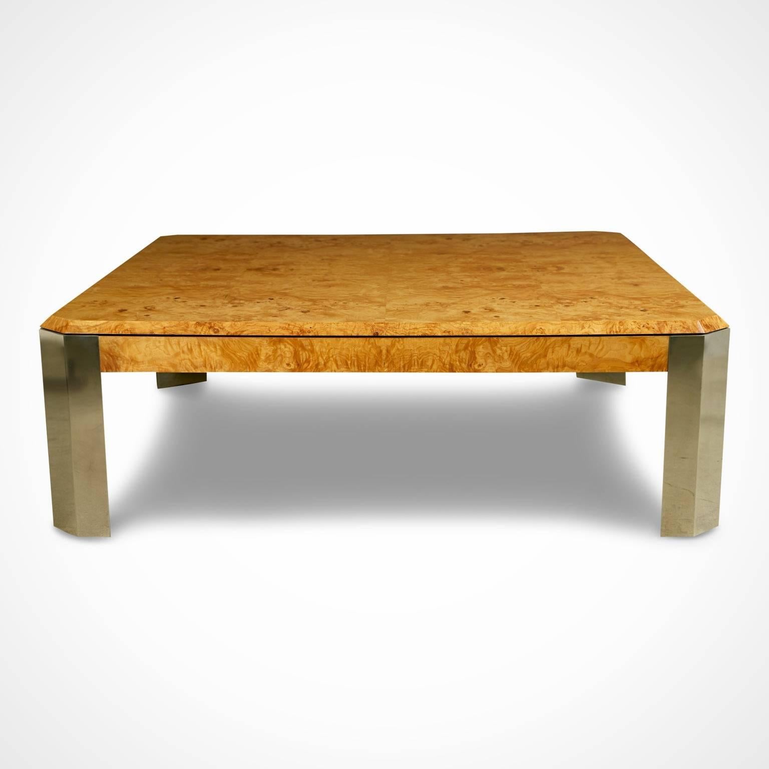 Expansive coffee table by Leon Rosen for The Pace collection. This vastly proportioned cocktail table is fabricated from exquisite lacquered burl wood which displays a mesmerizing grain and a stunning contrast of colors. The table is supported by