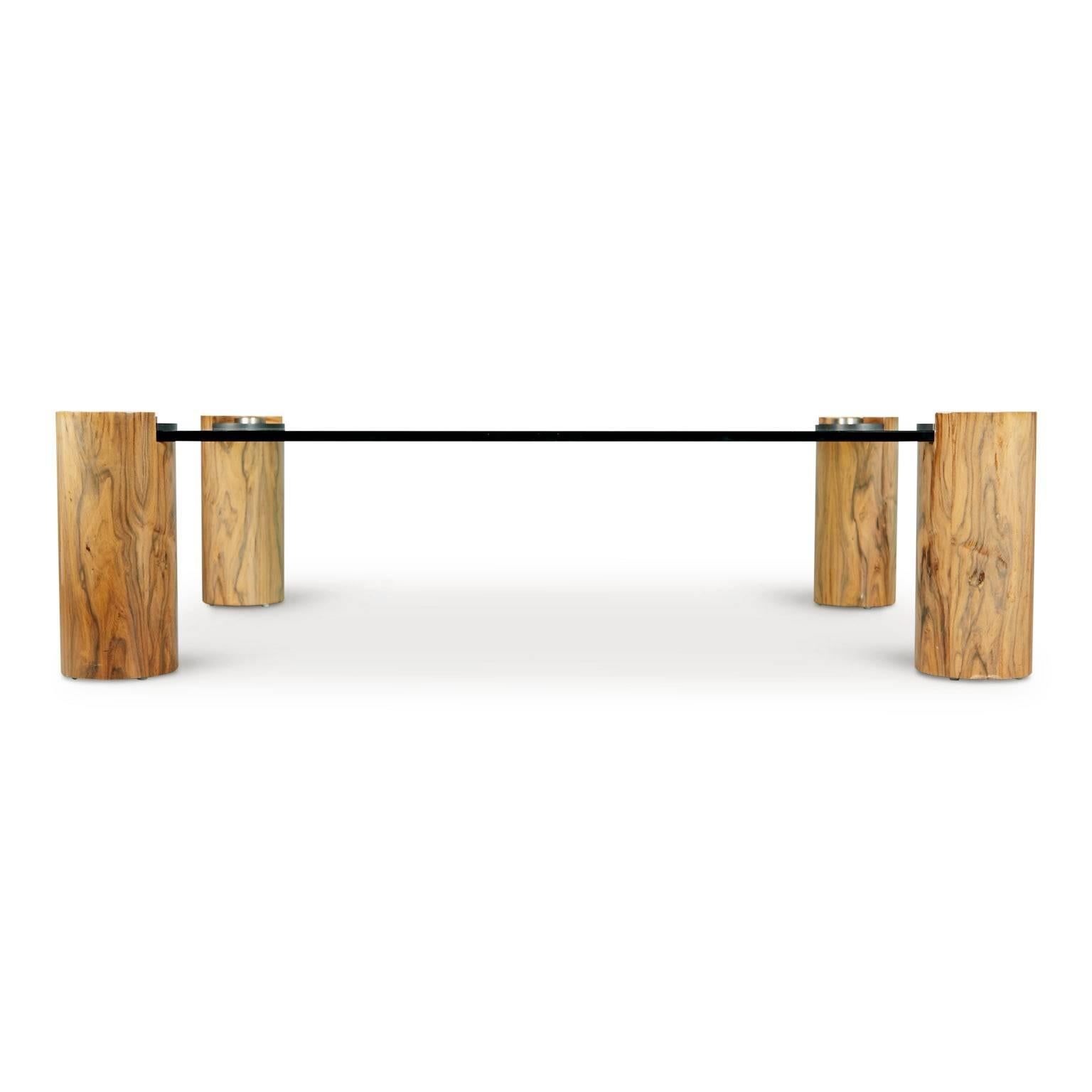 Known for his striking designs and use of exotic woods and luxurious materials, this cocktail table is an excellent example of Karl Springer's work. This expansively proportioned cocktail table displays Springer's keen sensibility for luxury and