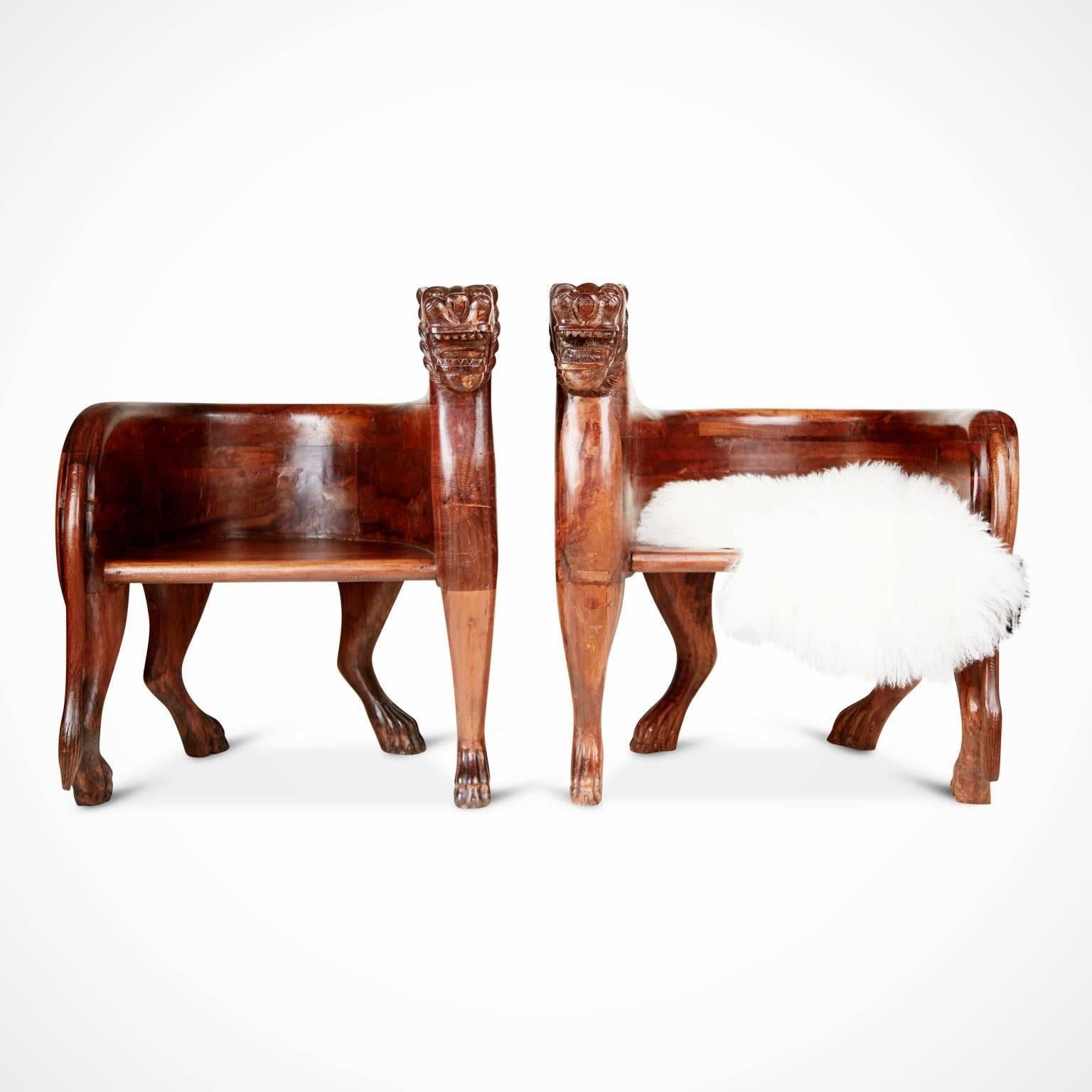 A spectacular and unique find, this pair of figural carved teak Lioness chairs is front-cover-magazine-worthy and can add a bit of the unexpected to any style of room. Consider using at the ends of a long dining table, in a living room or den, next