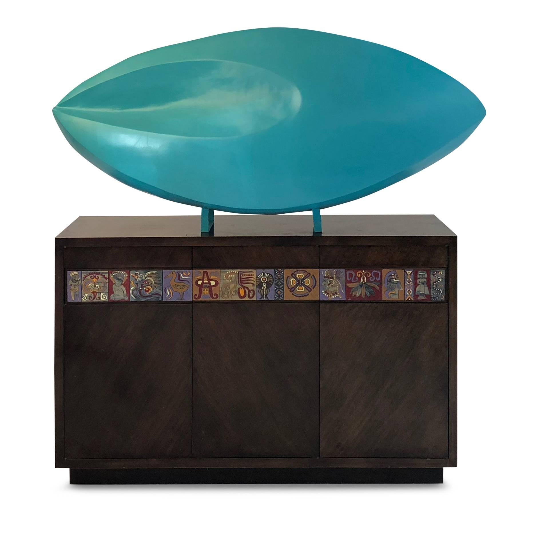 Sizable abstracted oval shaped sculpture, circa 1980. This art object is fabricated from fiberglass and has been painted in a vivid teal color. The loosely ellipse shaped piece curves to form pointed opposing ends and there is a scooped out shape